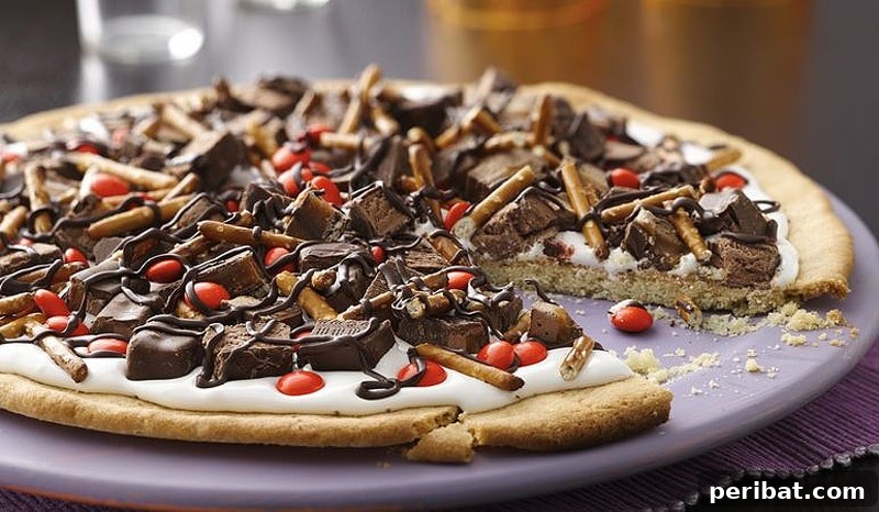 42 Spooktacular DIY Halloween Cookie Treats 11 Halloween candy cookie pizza topped with various sweets