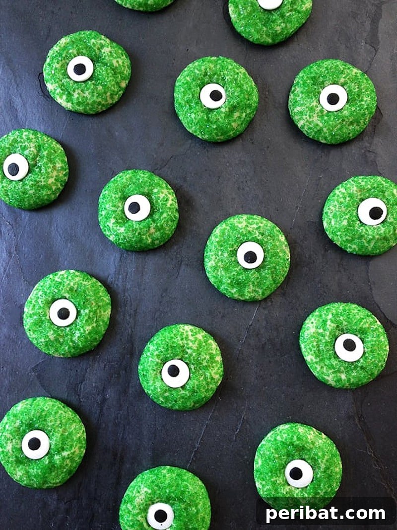 42 Spooktacular DIY Halloween Cookie Treats 16 Spooky eyeball Halloween sugar cookies with green irises