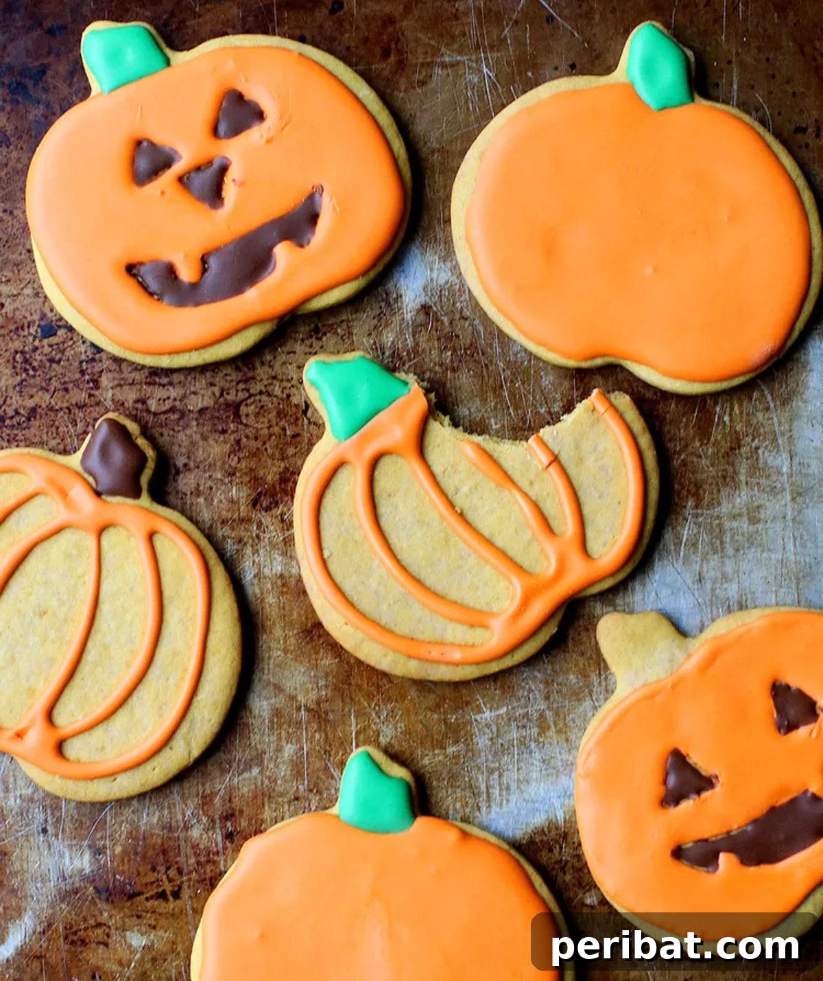 42 Spooktacular DIY Halloween Cookie Treats 27 Pumpkin-shaped sugar cookie