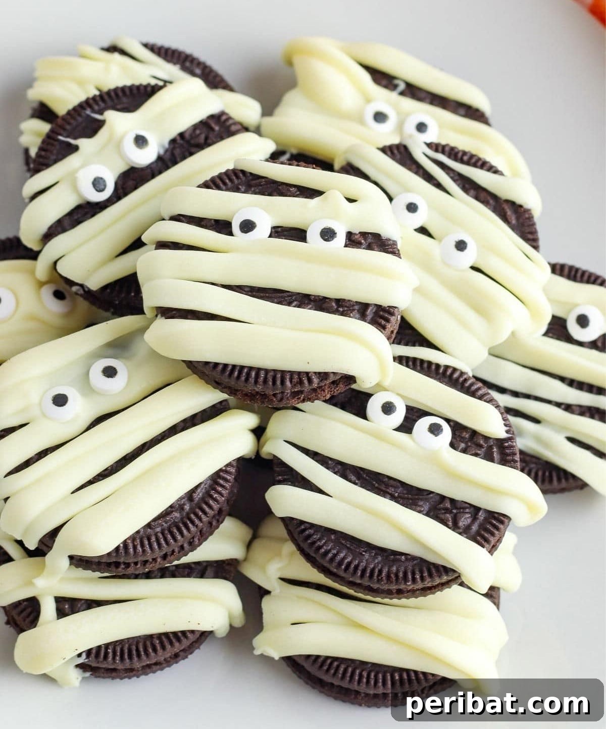42 Spooktacular DIY Halloween Cookie Treats 29 Mummy Halloween cookies wrapped in icing