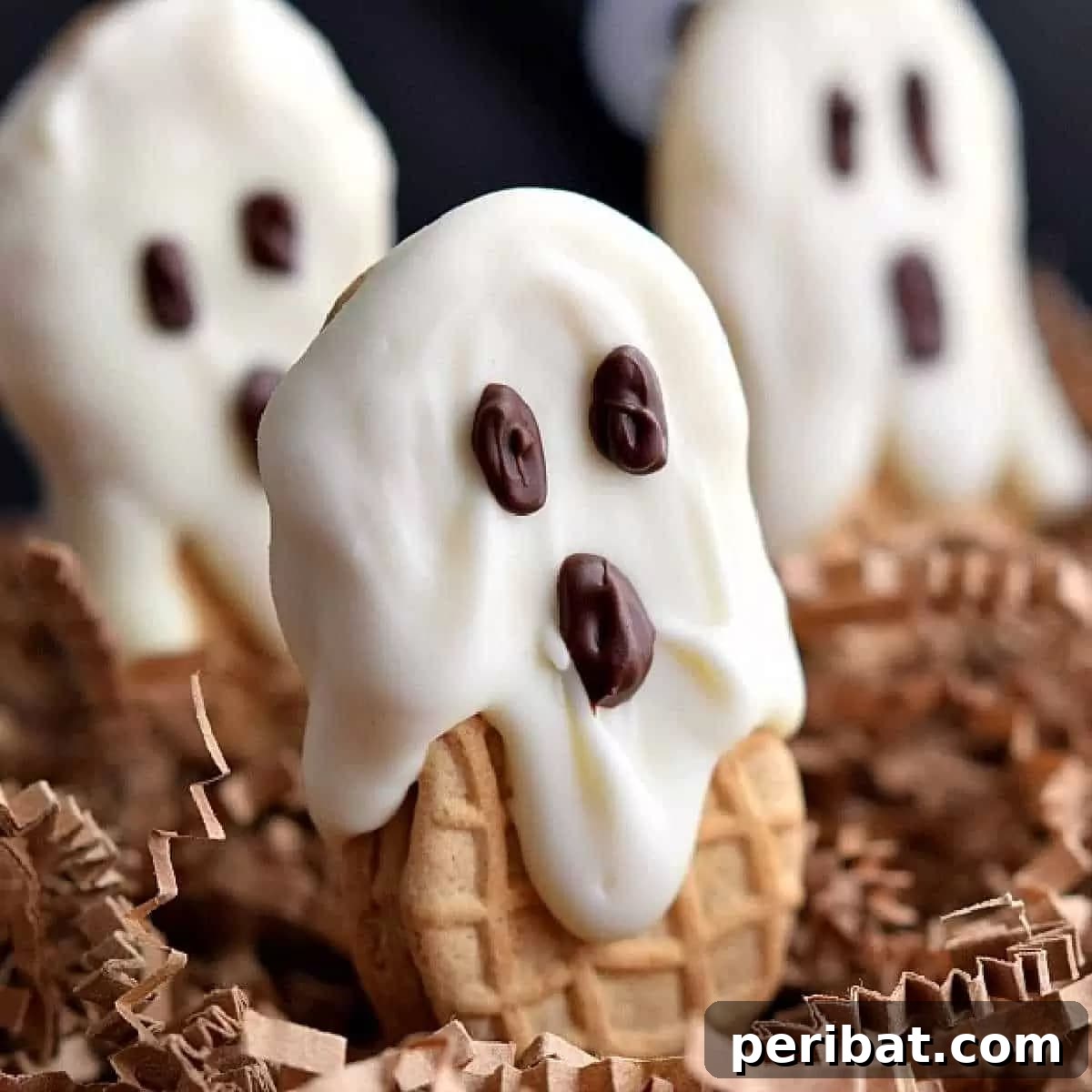 42 Spooktacular DIY Halloween Cookie Treats 32 Nutter Butter ghost cookies with candy eyes
