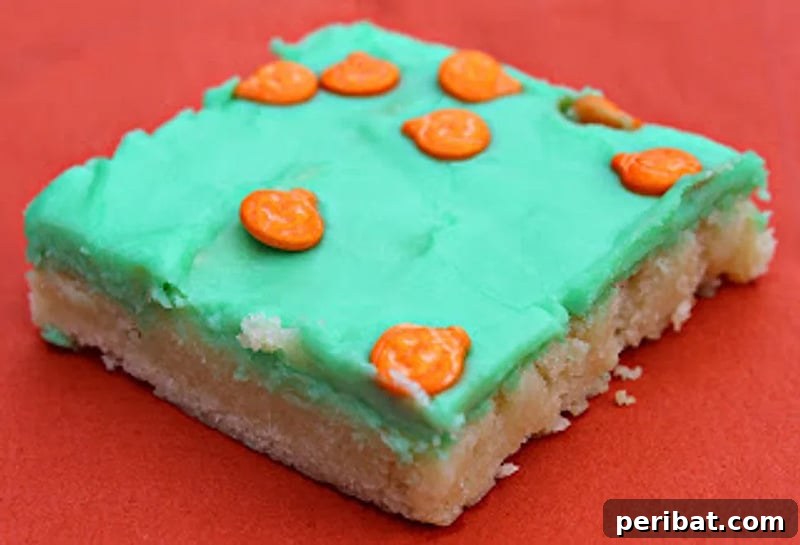 42 Spooktacular DIY Halloween Cookie Treats 7 Halloween sugar cookie bars with orange and green frosting
