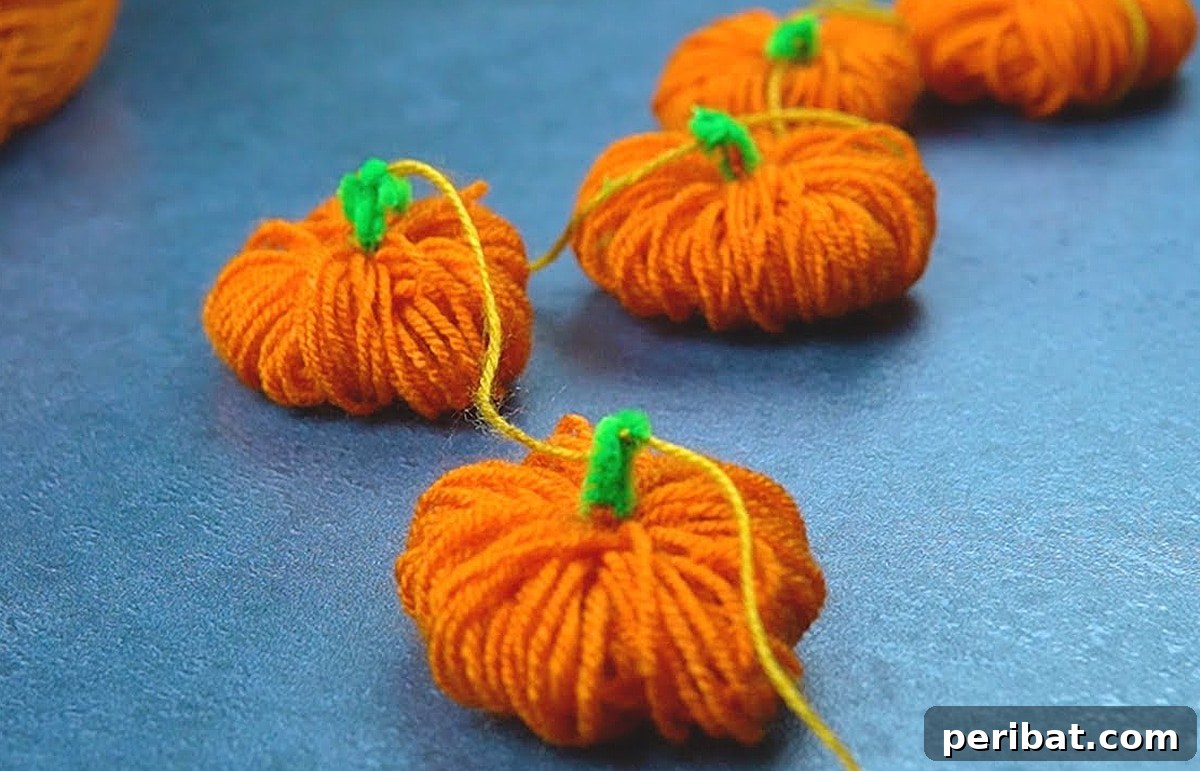 Simple DIY Ideas for Grown-Ups 50 Projects 17 yarn pumpkin garland tutorial