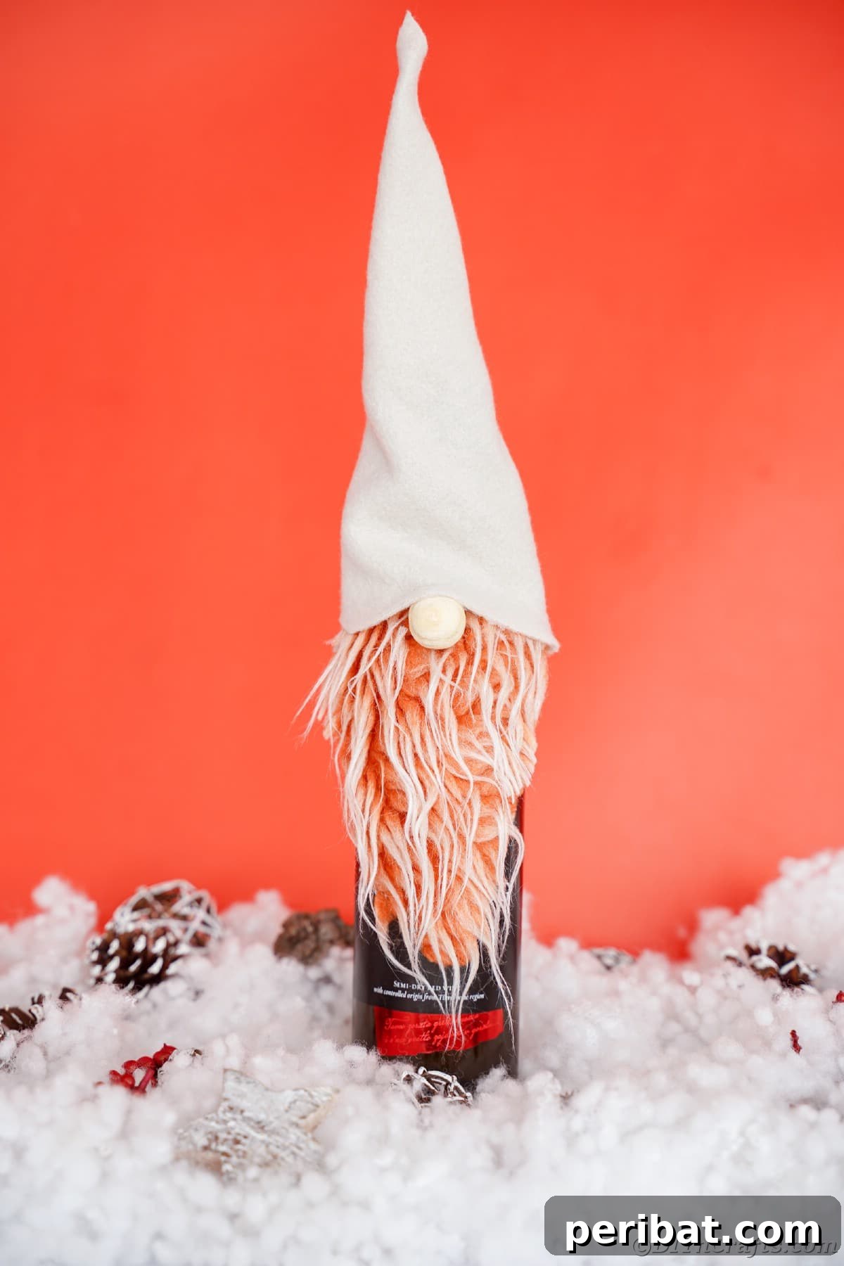 Simple DIY Ideas for Grown-Ups 50 Projects 4 gnome on top of wine bottle sitting on fake snow with red background