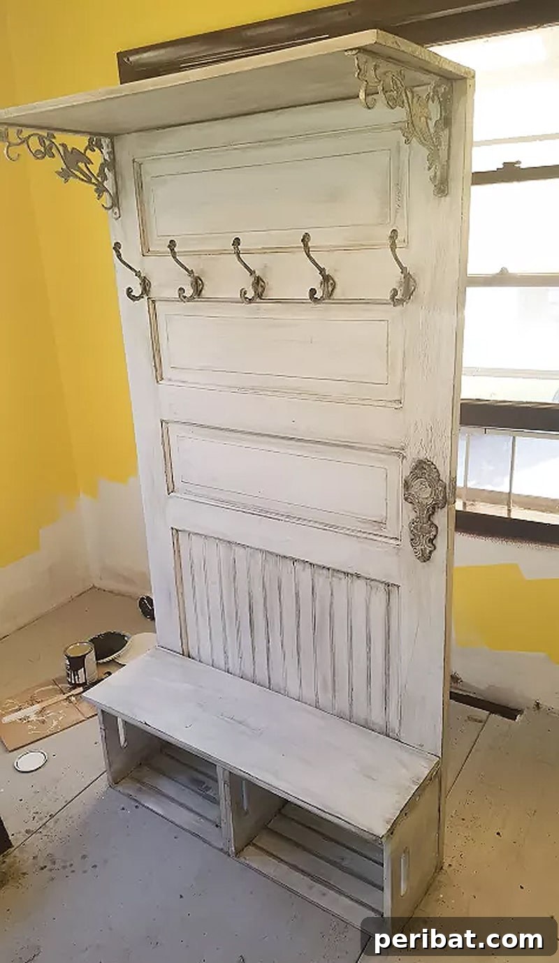 50 Smart DIY Home Improvement Hacks & Essential Products 18 Creative shelf crafted from an old door, transformed into a functional and stylish entryway storage solution