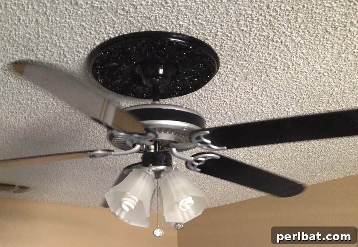 50 Smart DIY Home Improvement Hacks & Essential Products 21 Modern ceiling fan with updated blades and finish, showcasing a simple DIY project to enhance room decor and functionality