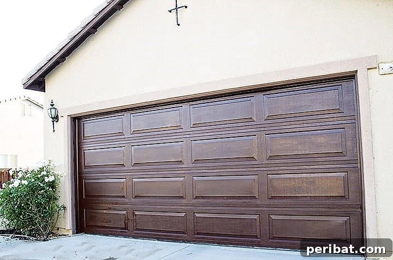 50 Smart DIY Home Improvement Hacks & Essential Products 25 Sophisticated DIY garage door makeover with a rich wood stain, enhancing curb appeal and creating a welcoming home exterior