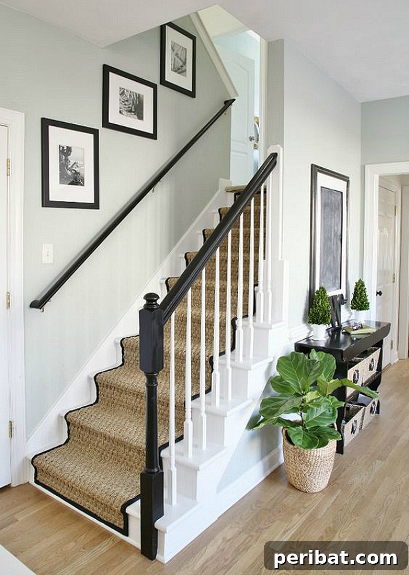 50 Smart DIY Home Improvement Hacks & Essential Products 34 Beautifully painted staircase makeover featuring a natural seagrass runner, adding coastal charm and durability to home stairs
