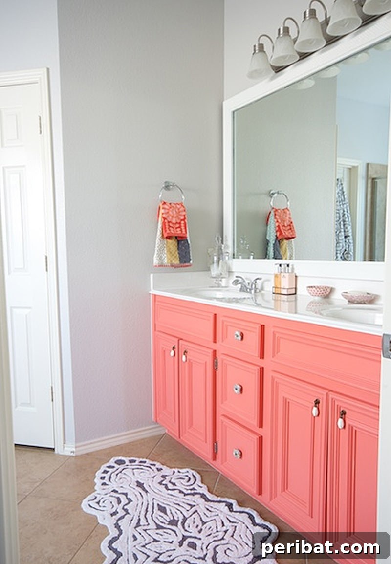50 Smart DIY Home Improvement Hacks & Essential Products 41 Charming DIY painted coral vanity, bringing a fresh dose of art and vibrant color to an empty space in a home