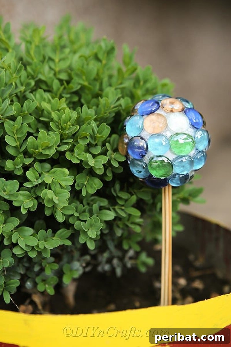 50 Smart DIY Home Improvement Hacks & Essential Products 6 Elegant DIY lawn ornament crafted with glass nuggets, sparkling under the sun to enhance garden aesthetics