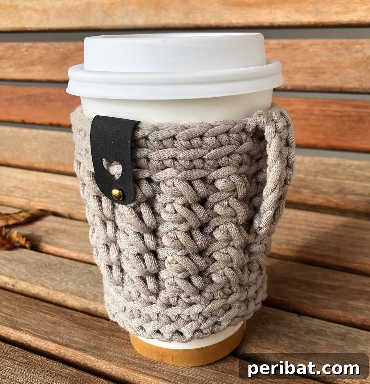 Crochet drink sleeve pattern designed for taller cups, featuring a practical loop for extra grip