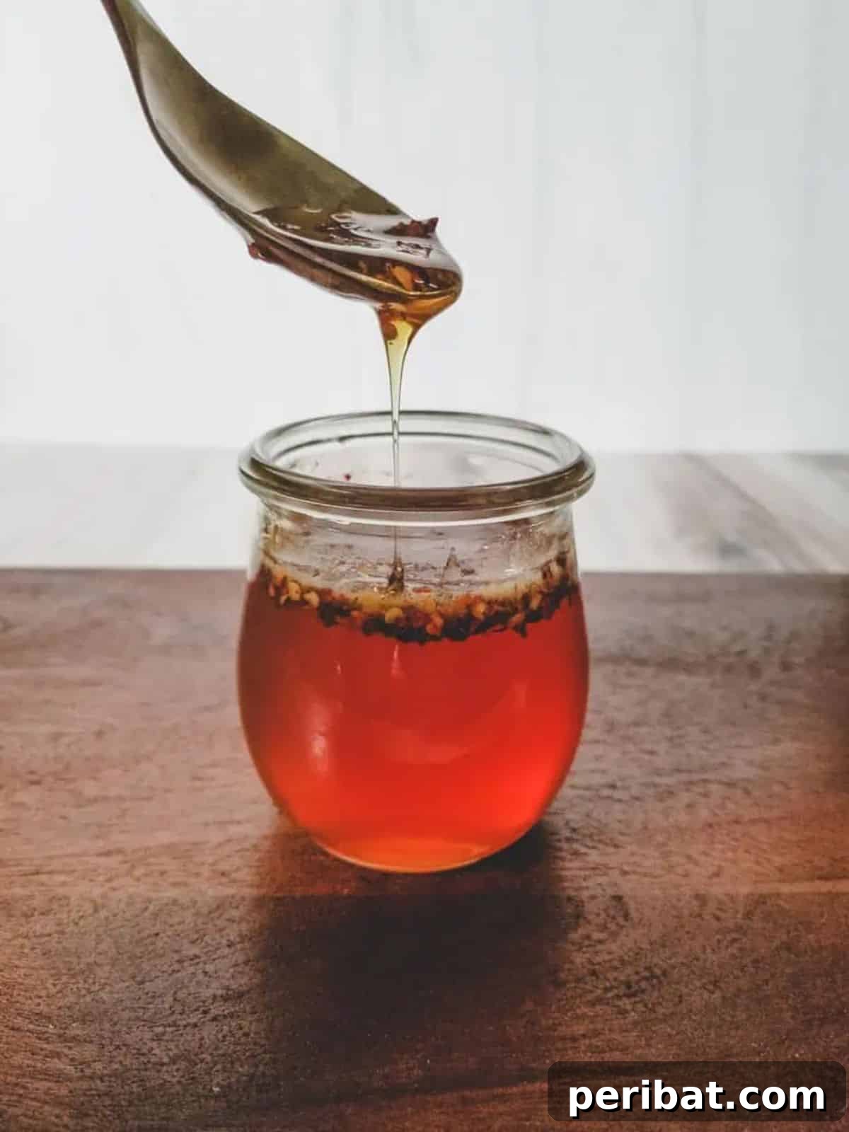 Craft Your Own Heat 26 DIY Hot Sauce Kits and Recipes 18 A jar of golden Hot Honey, infused with chili flakes.
