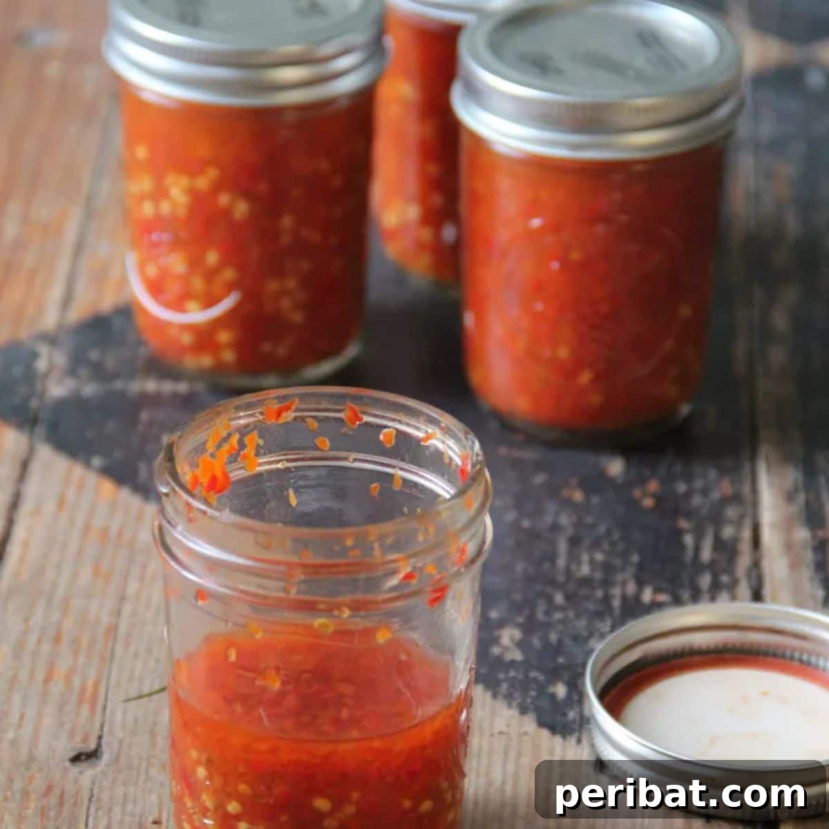 Craft Your Own Heat 26 DIY Hot Sauce Kits and Recipes 19 Glass jars filled with vibrant Jamaican Hot Sauce.