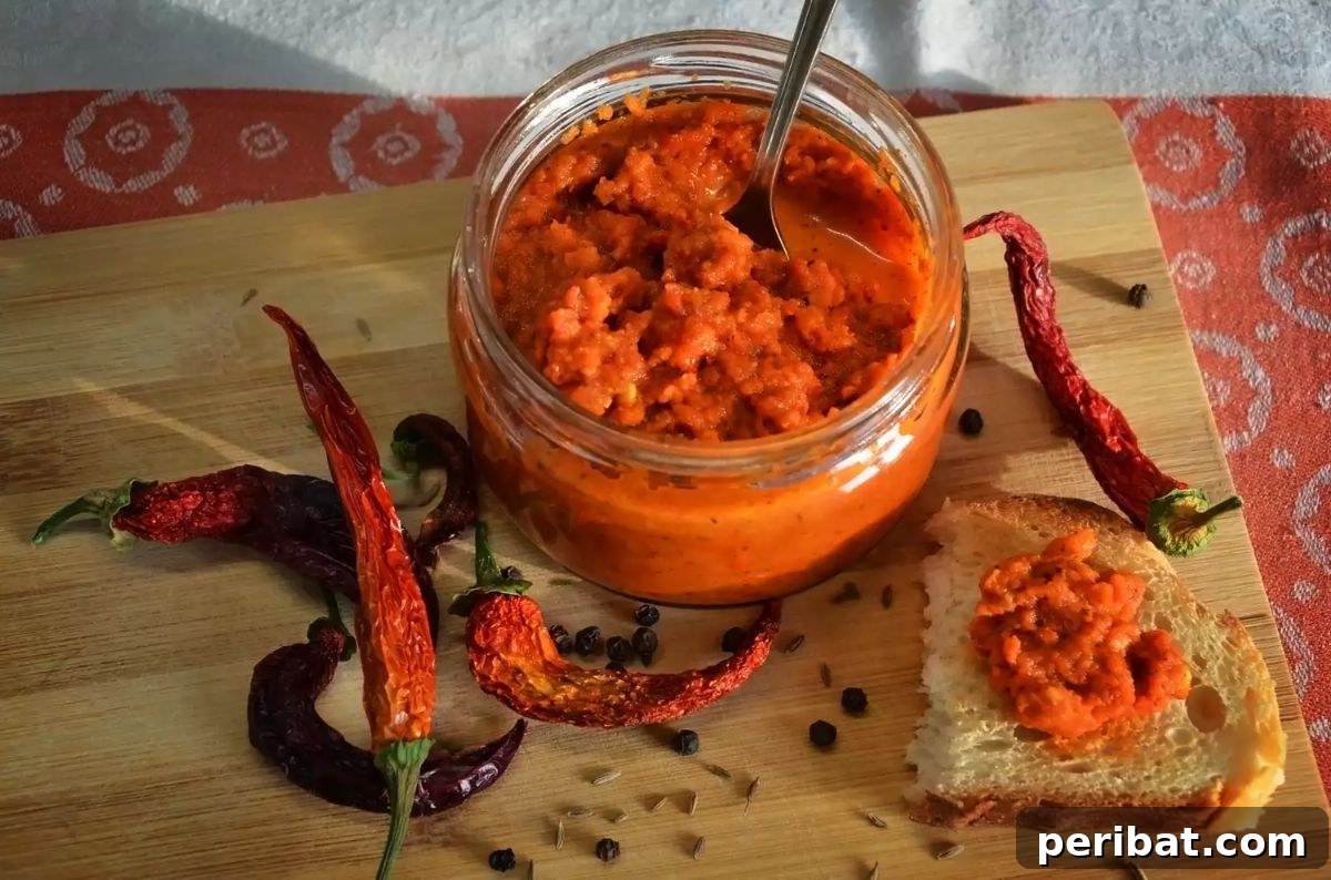 Craft Your Own Heat 26 DIY Hot Sauce Kits and Recipes 20 A jar of rich Chef John's Harissa Sauce, showcasing its deep red hue.