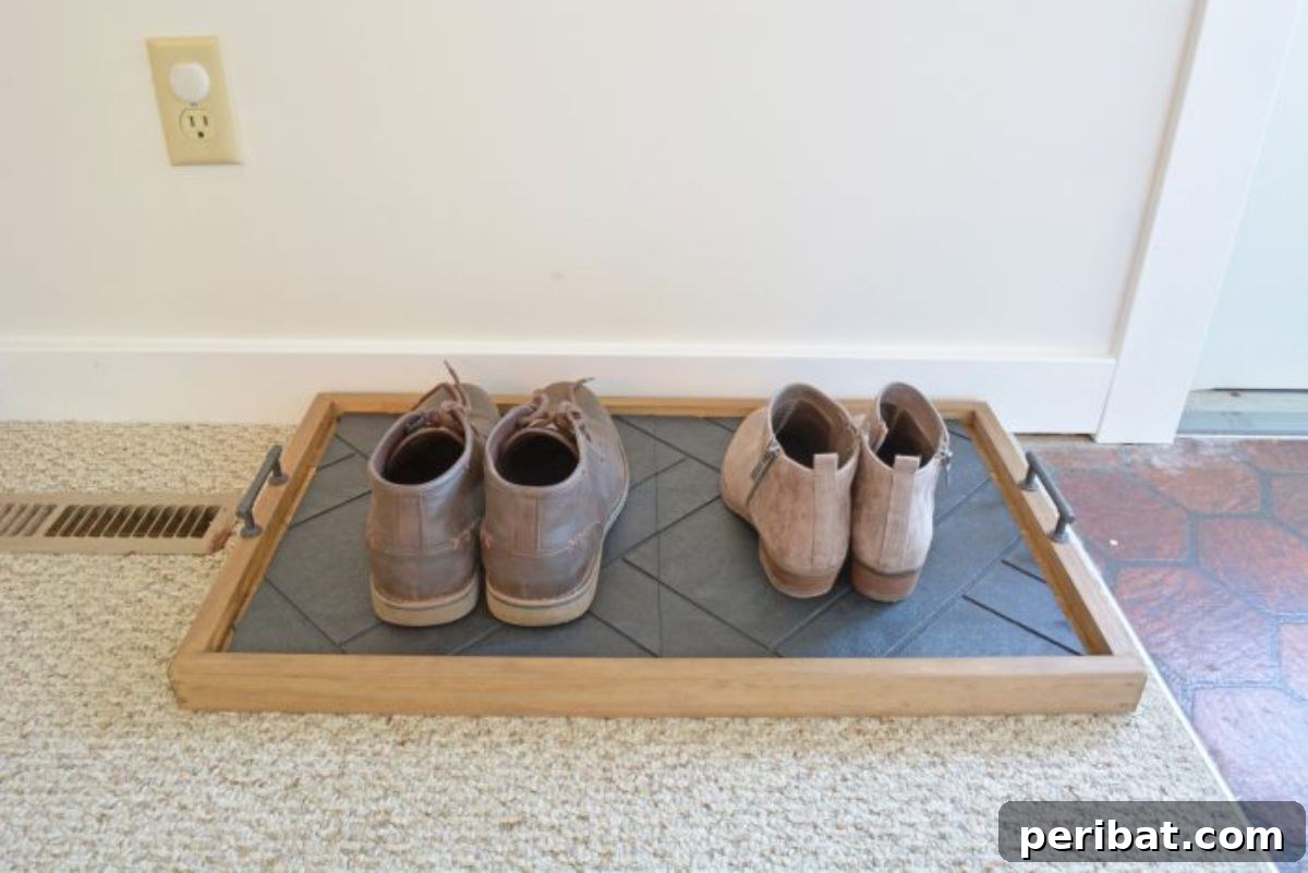 Transform Your Entryway: 32 Genius DIY Organizing Ideas 26 DIY entryway shoe tray for organizing footwear.