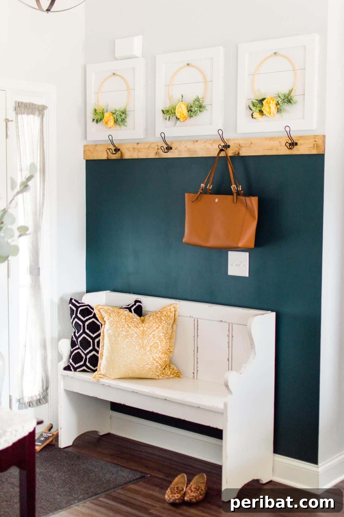 Transform Your Entryway: 32 Genius DIY Organizing Ideas 27 Colorful DIY entryway makeover featuring painted walls and coat hooks.