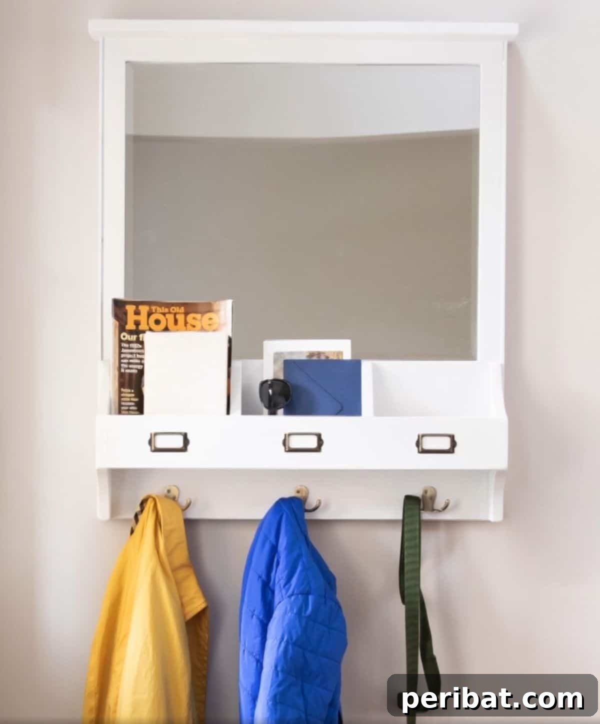 Transform Your Entryway: 32 Genius DIY Organizing Ideas 31 DIY entryway organizer featuring a mirror and storage compartments.