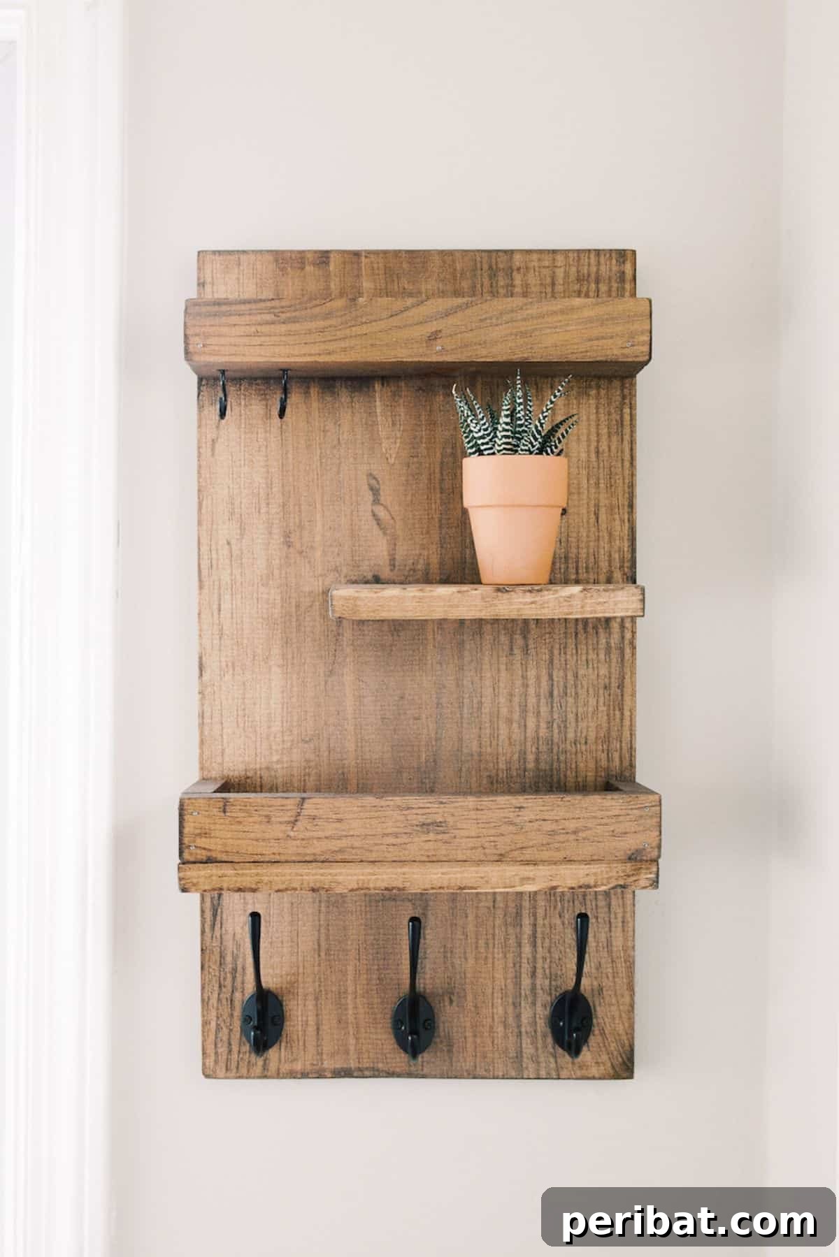 Transform Your Entryway: 32 Genius DIY Organizing Ideas 5 Rustic tiered DIY entryway organizer for mail and keys.