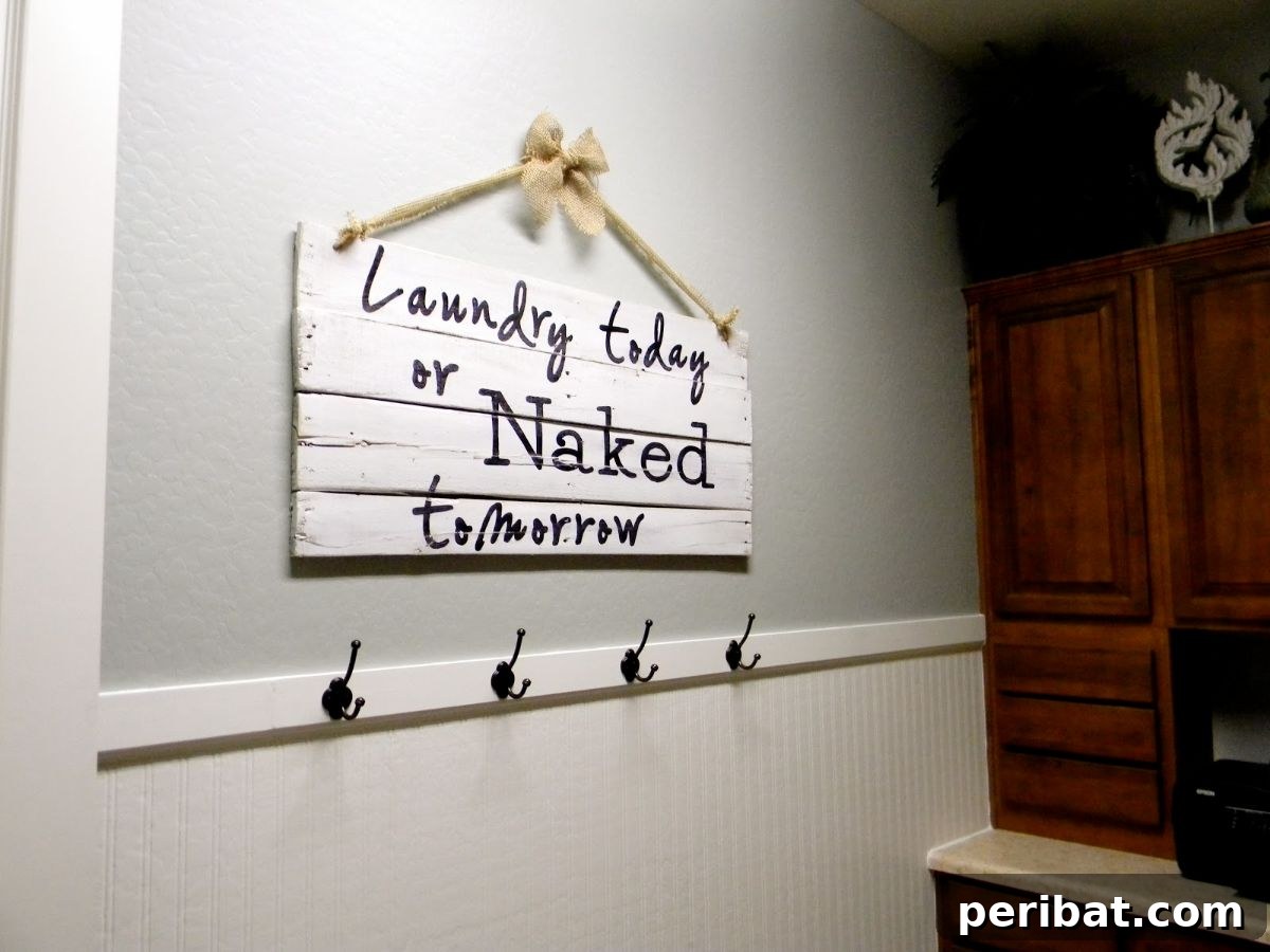 DIY Pallet Sign Hung in Burlap Ribbon