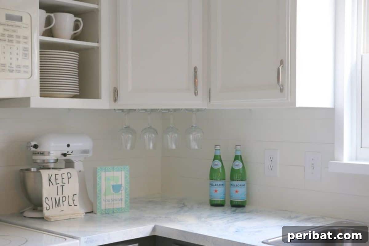 Instant Style: 32 DIY Peel and Stick Backsplash Makeovers 22 DIY Faux Shiplap Backsplash With Peel ‘N Stick Flooring for Rustic Charm