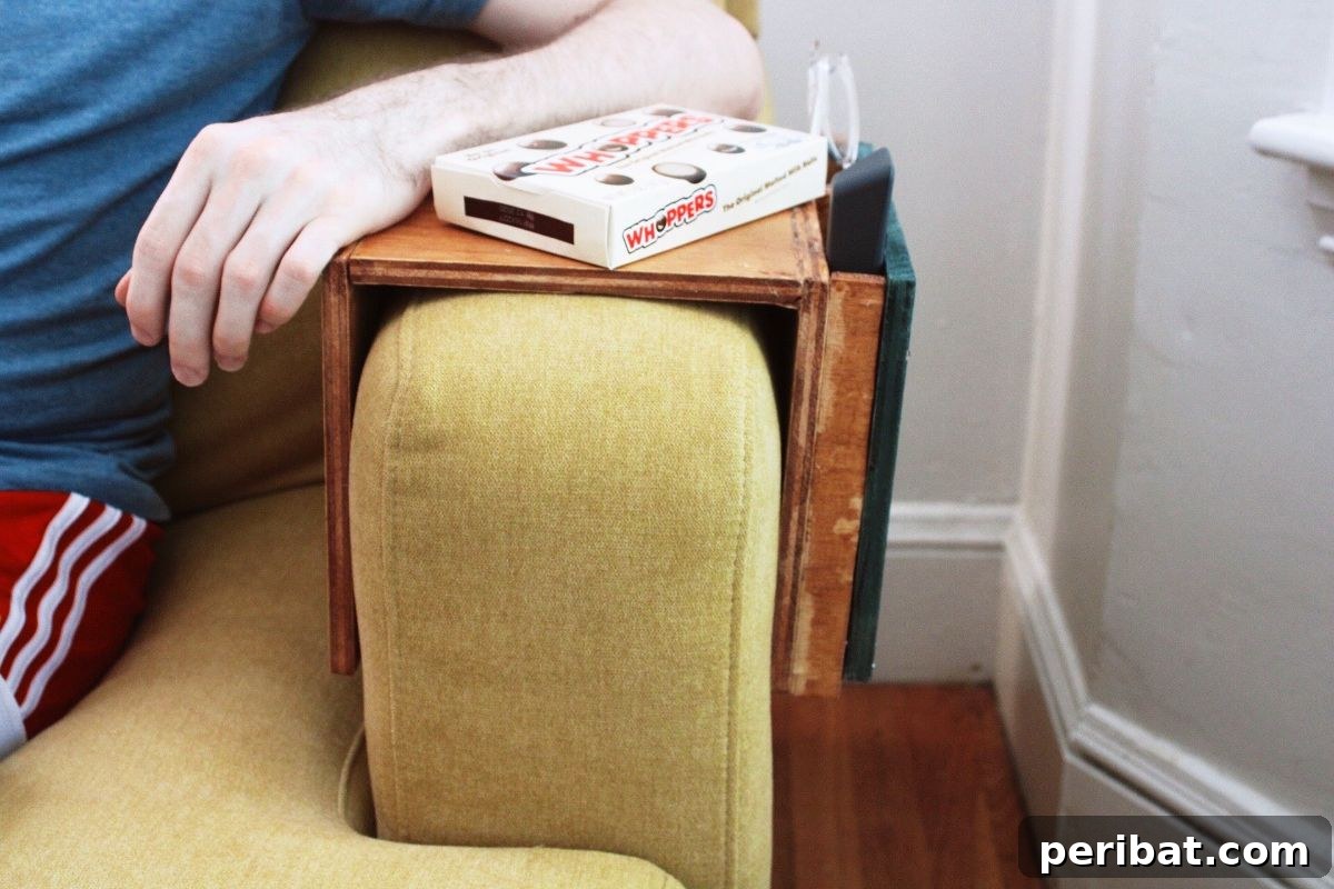 Organize with a Wooden Sofa Sleeve featuring Remote and Glasses Holder