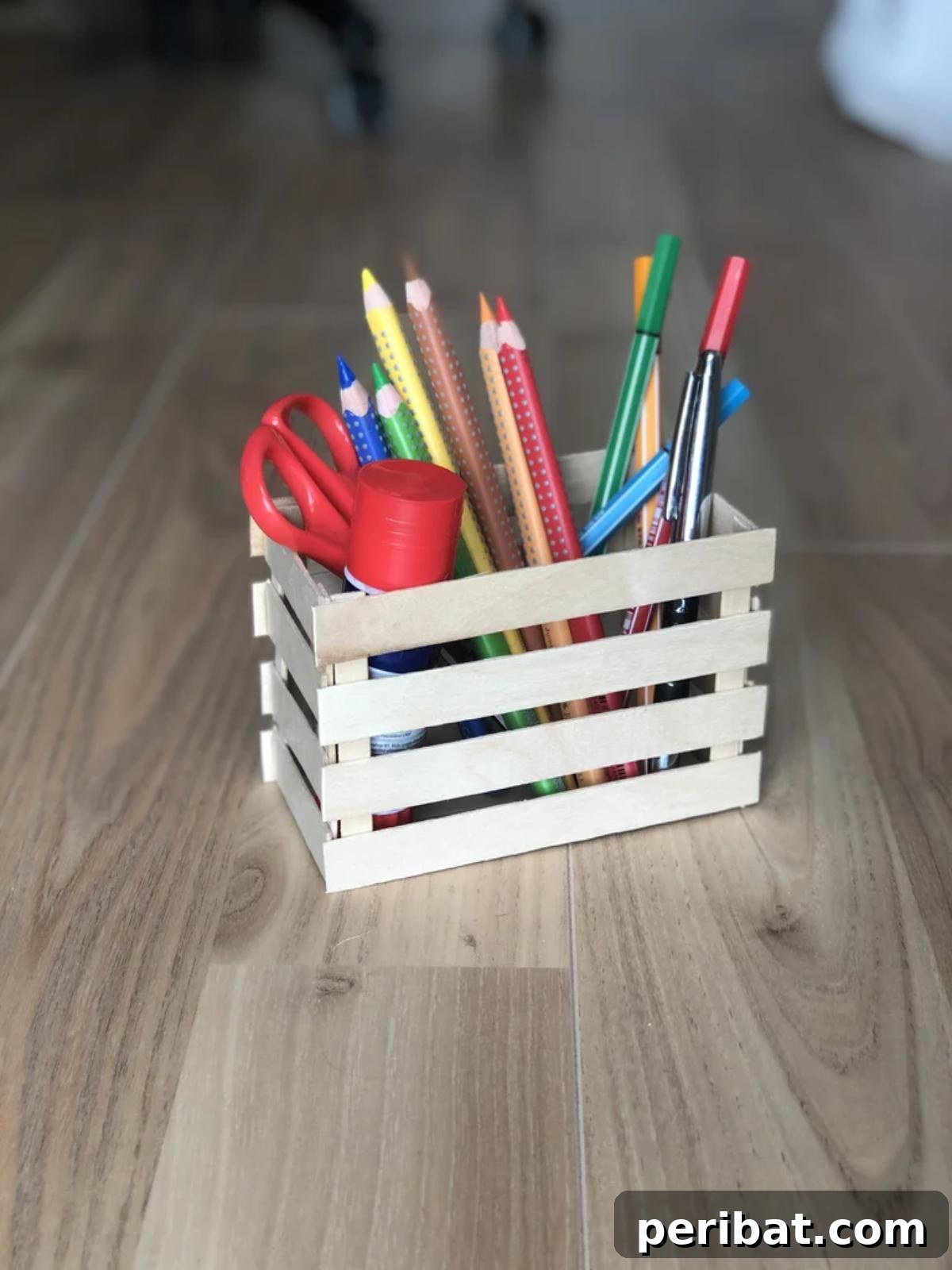 DIY Jumbo Sticks Pencil Holder, an appealing craft stick organizer for stationery or unique gift boxes.