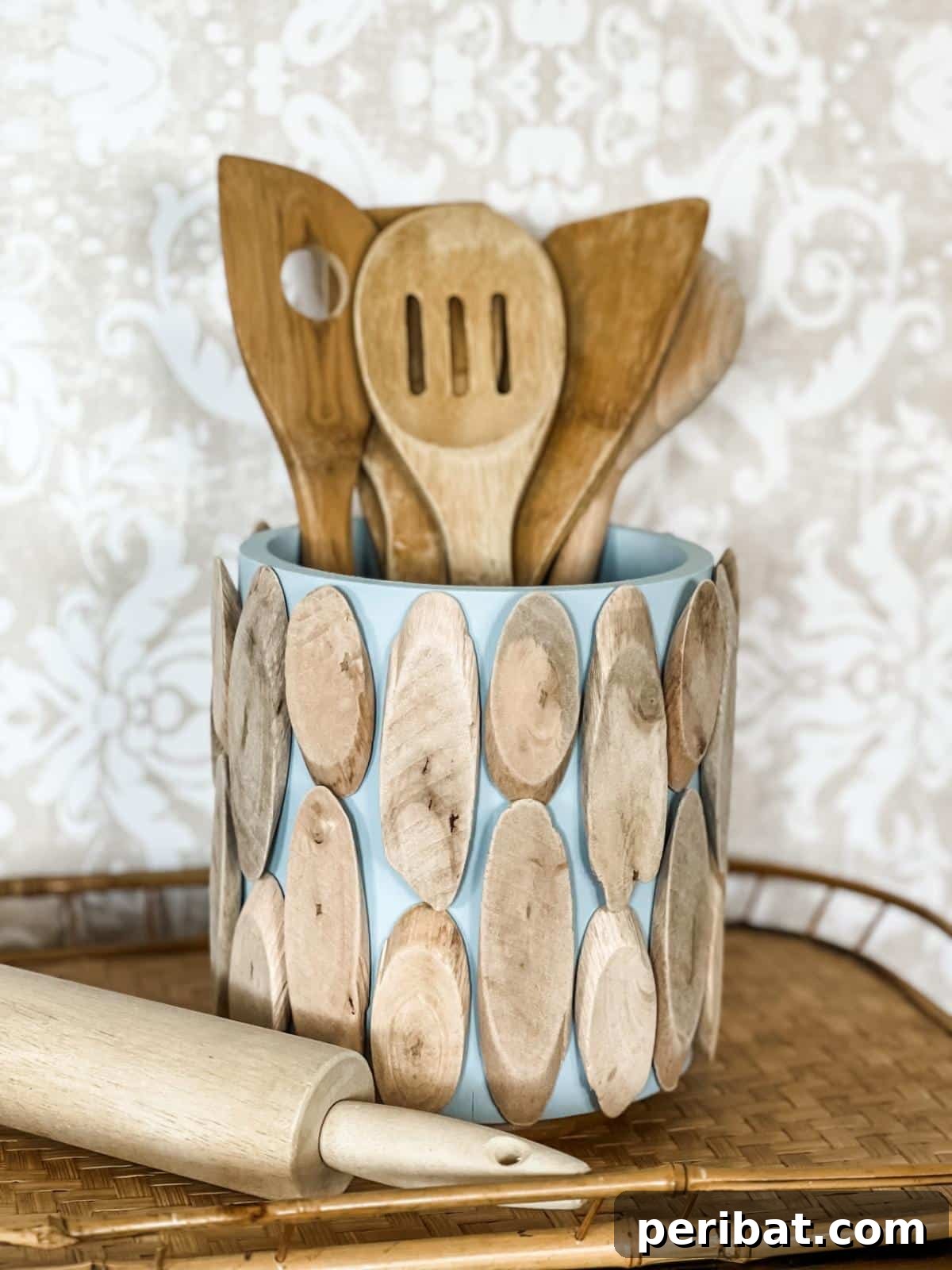 DIY Driftwood Utensil Holder, offering a unique and natural aesthetic for kitchen or outdoor dining.