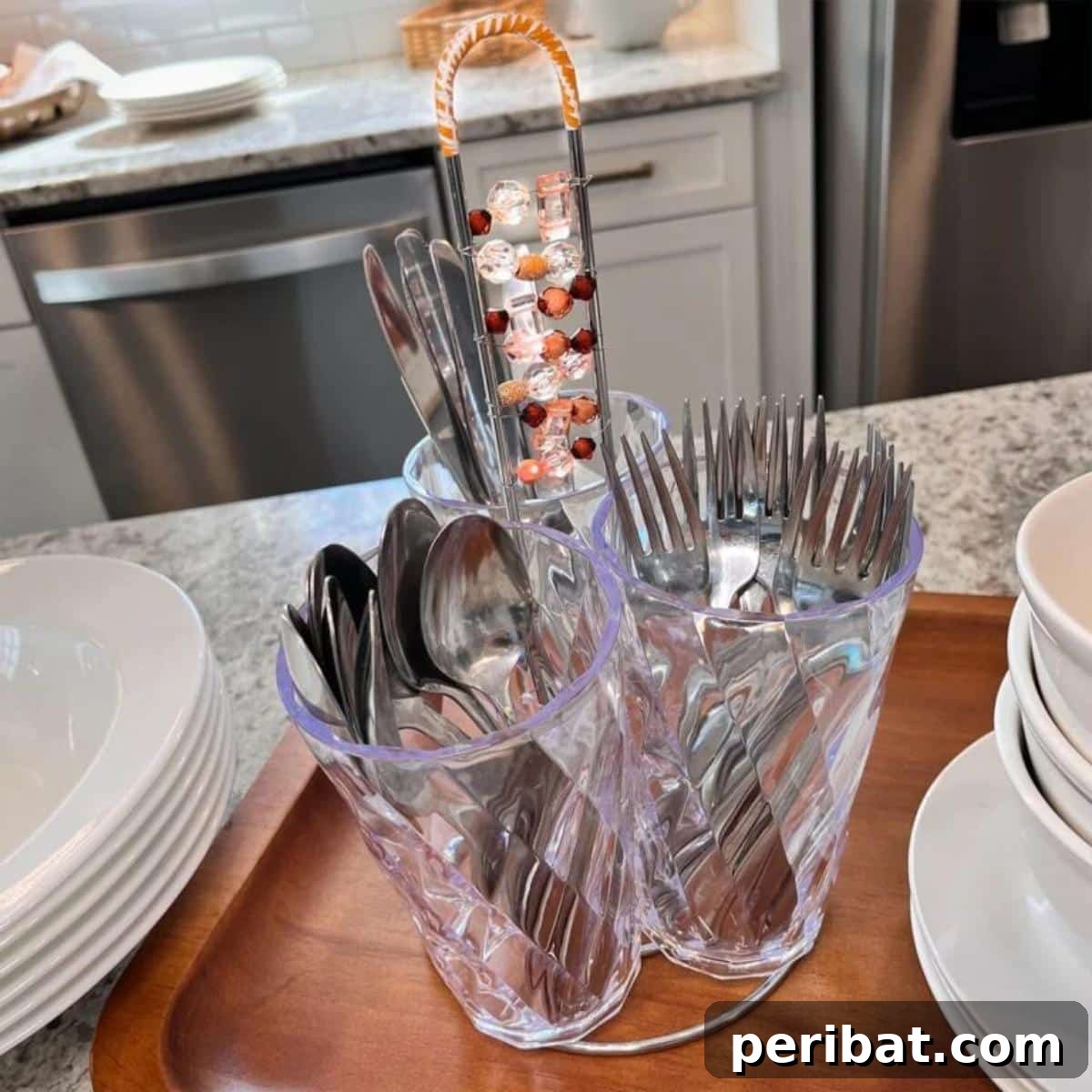 DIY Silverware Caddy made from plastic tumblers and a paper towel holder, perfect for outdoor gatherings and buffet-style events.