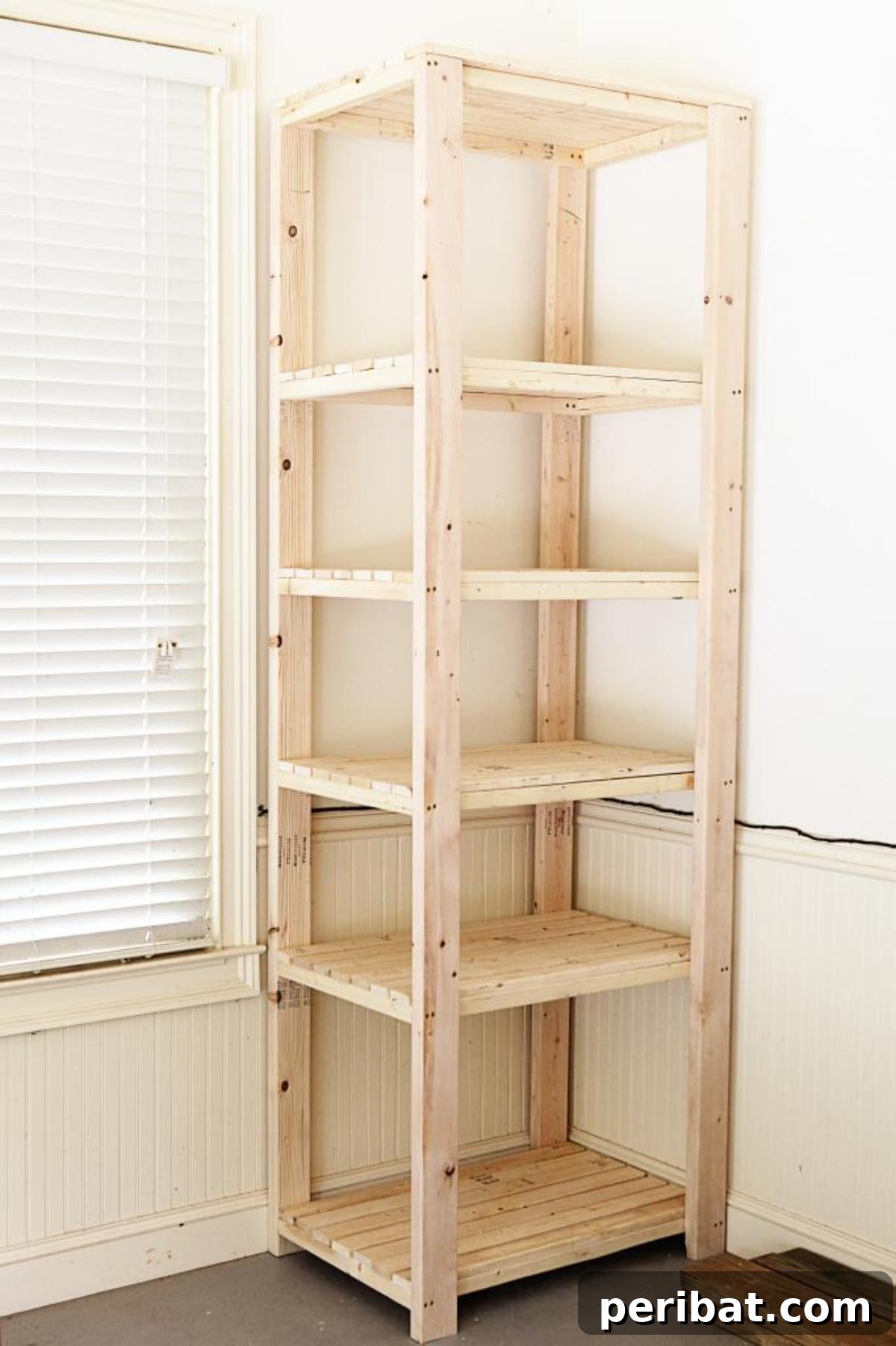 DIY Corner Tower Garage, showing a tall, multi-level corner shelving unit filled with neatly organized bins and various items.