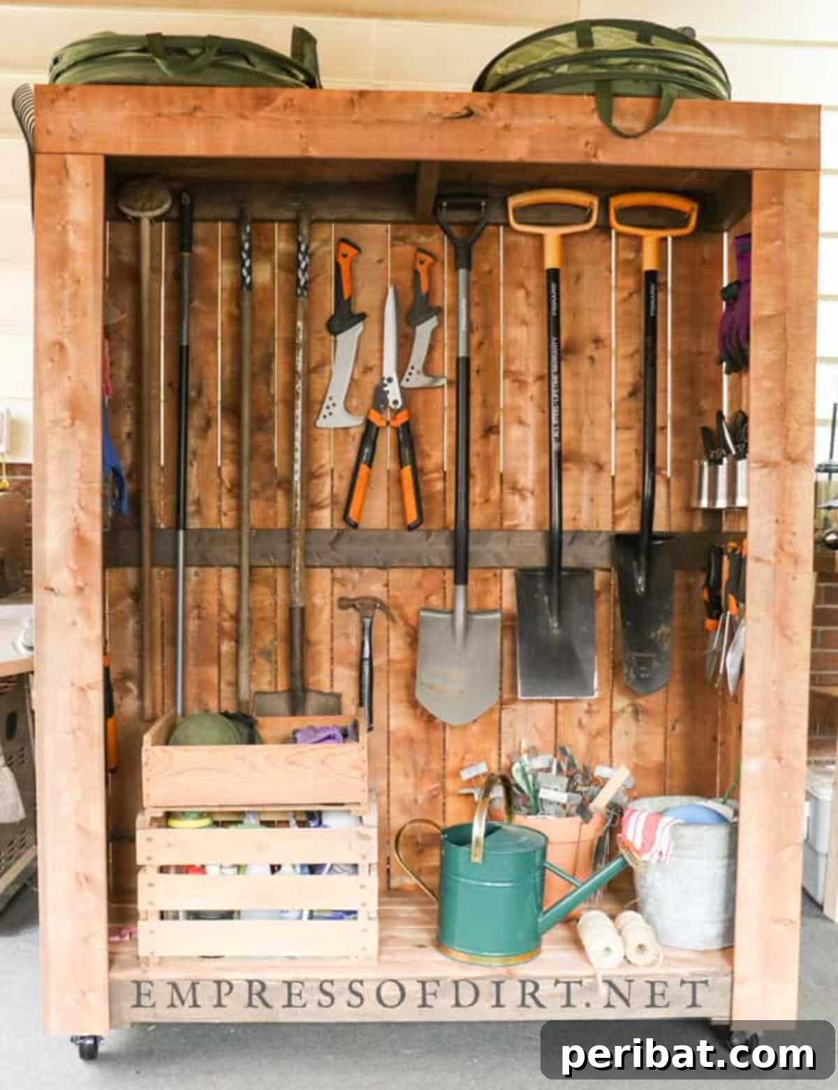 DIY Tool Garden Storage Shed on Wheels, featuring a compact, movable wooden storage unit with integrated shelves and hooks for garden tools.