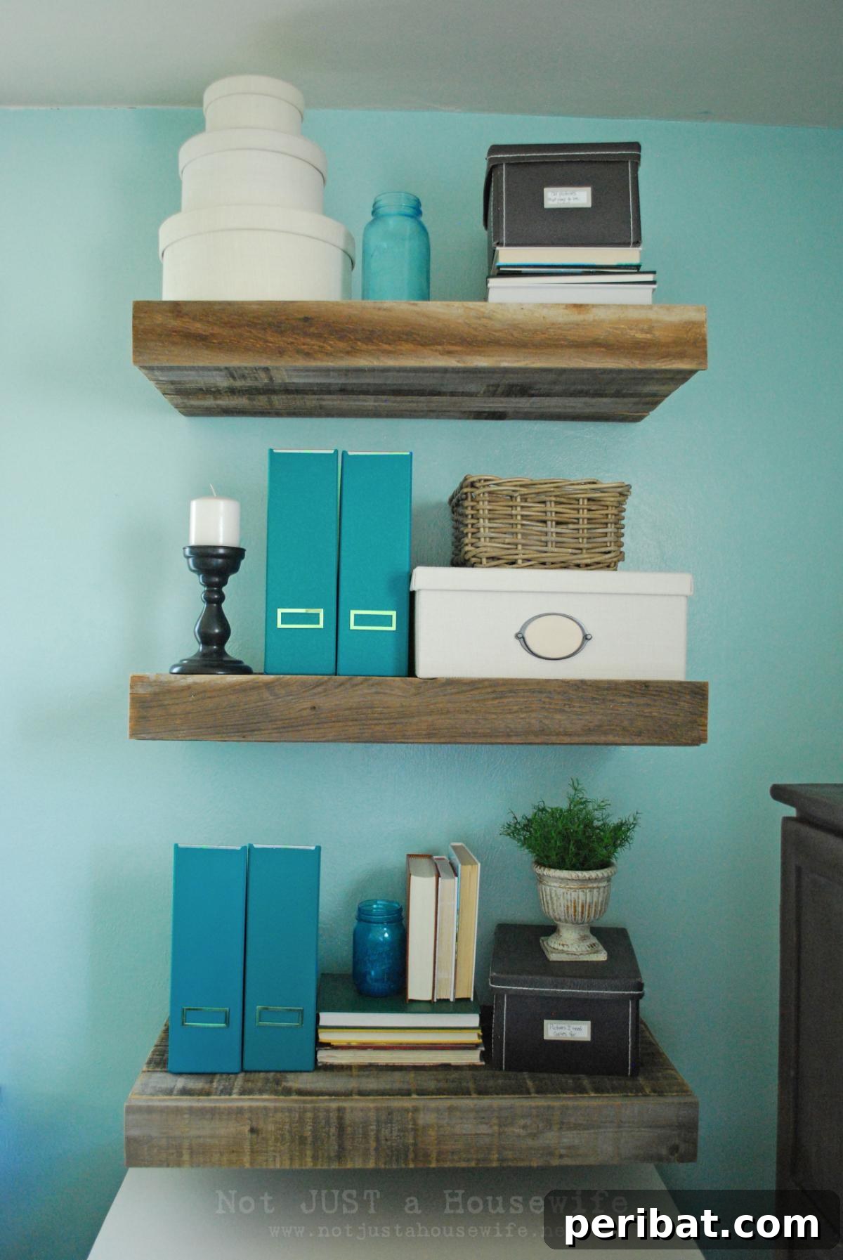 DIY Floating Reclaimed Wood Shelves, showing rustic-style shelves made from old, characterful wood, with small integrated drawers for hidden storage.