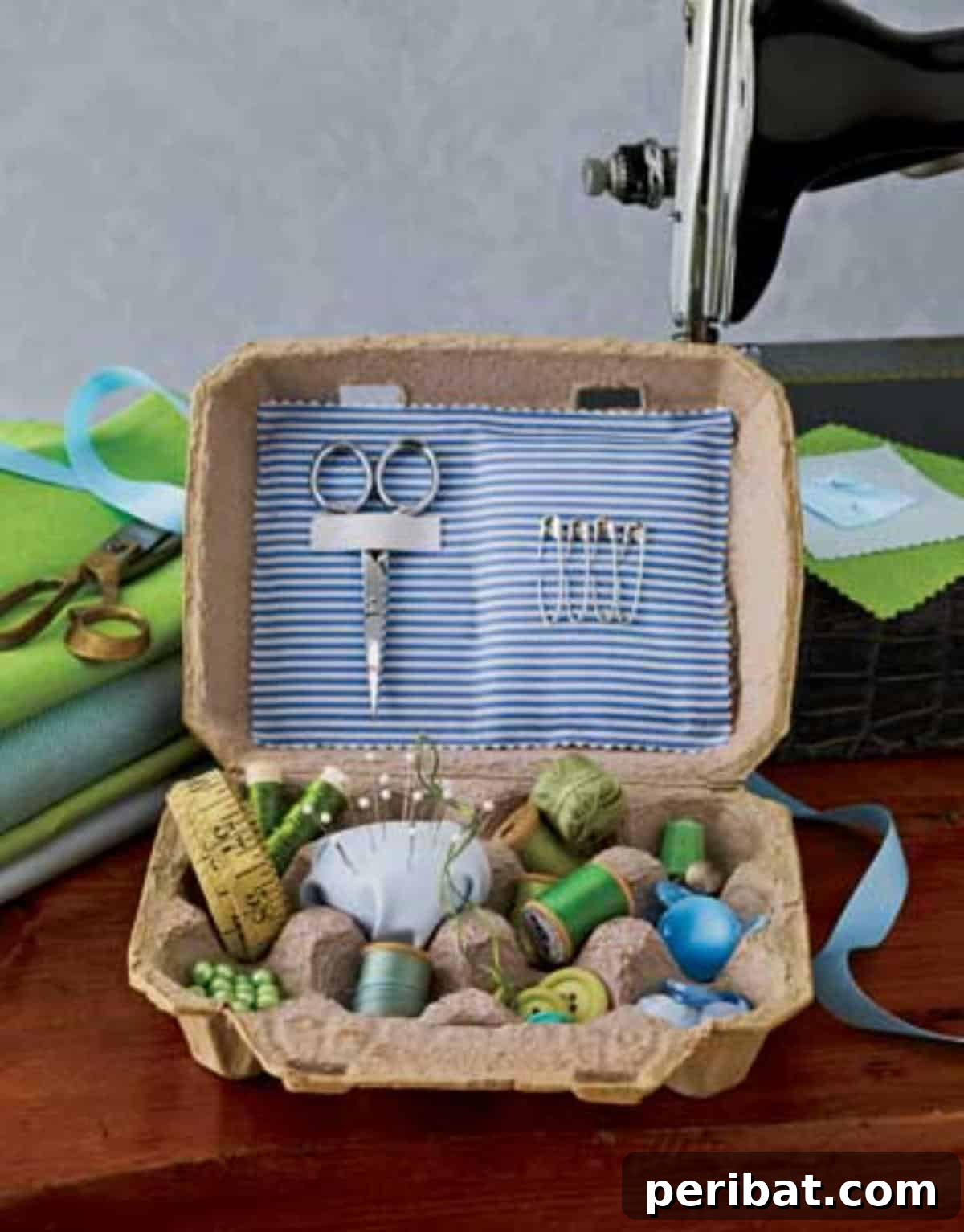 35 Mind-Blowing Creations from Empty Egg Cartons 33 A repurposed egg carton transformed into a practical craft container, neatly organizing sewing supplies like buttons, thread, and needles.