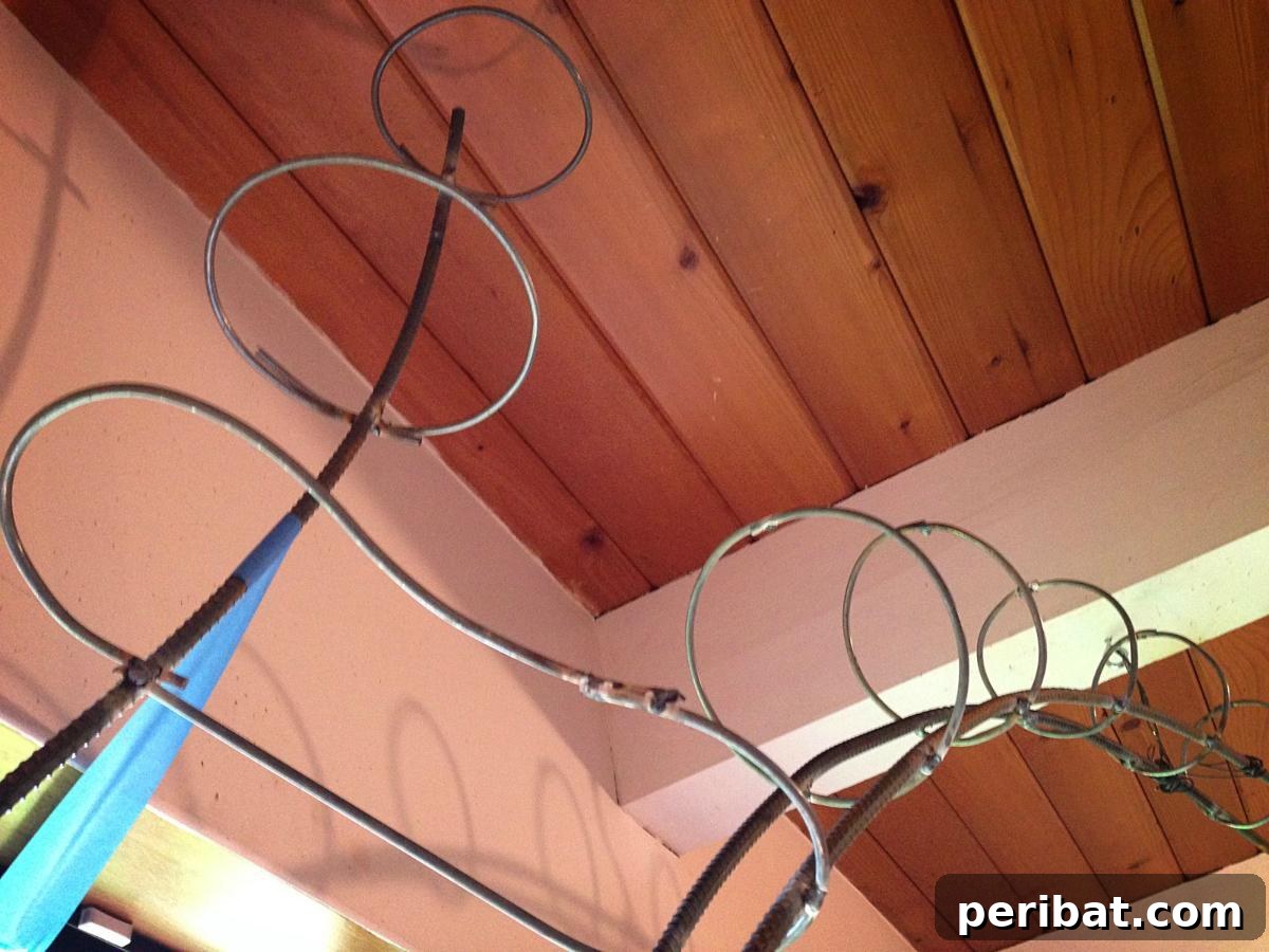 Dad Builds a Magical Indoor Tree, Turning Daughter's Bedroom Into a Dreamland 15 Bending steel rod to create curves for the tree branches