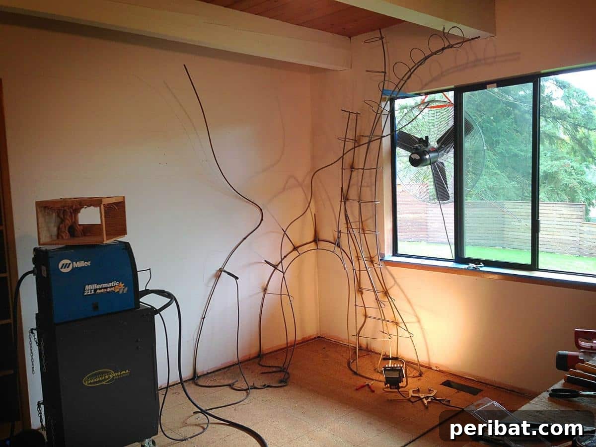Dad Builds a Magical Indoor Tree, Turning Daughter's Bedroom Into a Dreamland 16 Welding setup with a Miller 211 MIG welder and ventilation