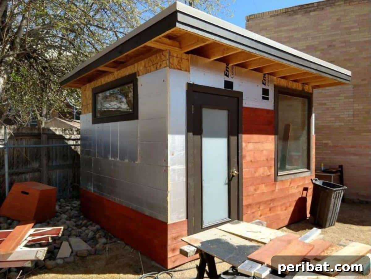 Unlock Your Potential: 42 Inspiring Backyard Studio Shed Designs 12 A meticulously constructed DIY backyard office, showcasing a modern design and a pristine finish.
