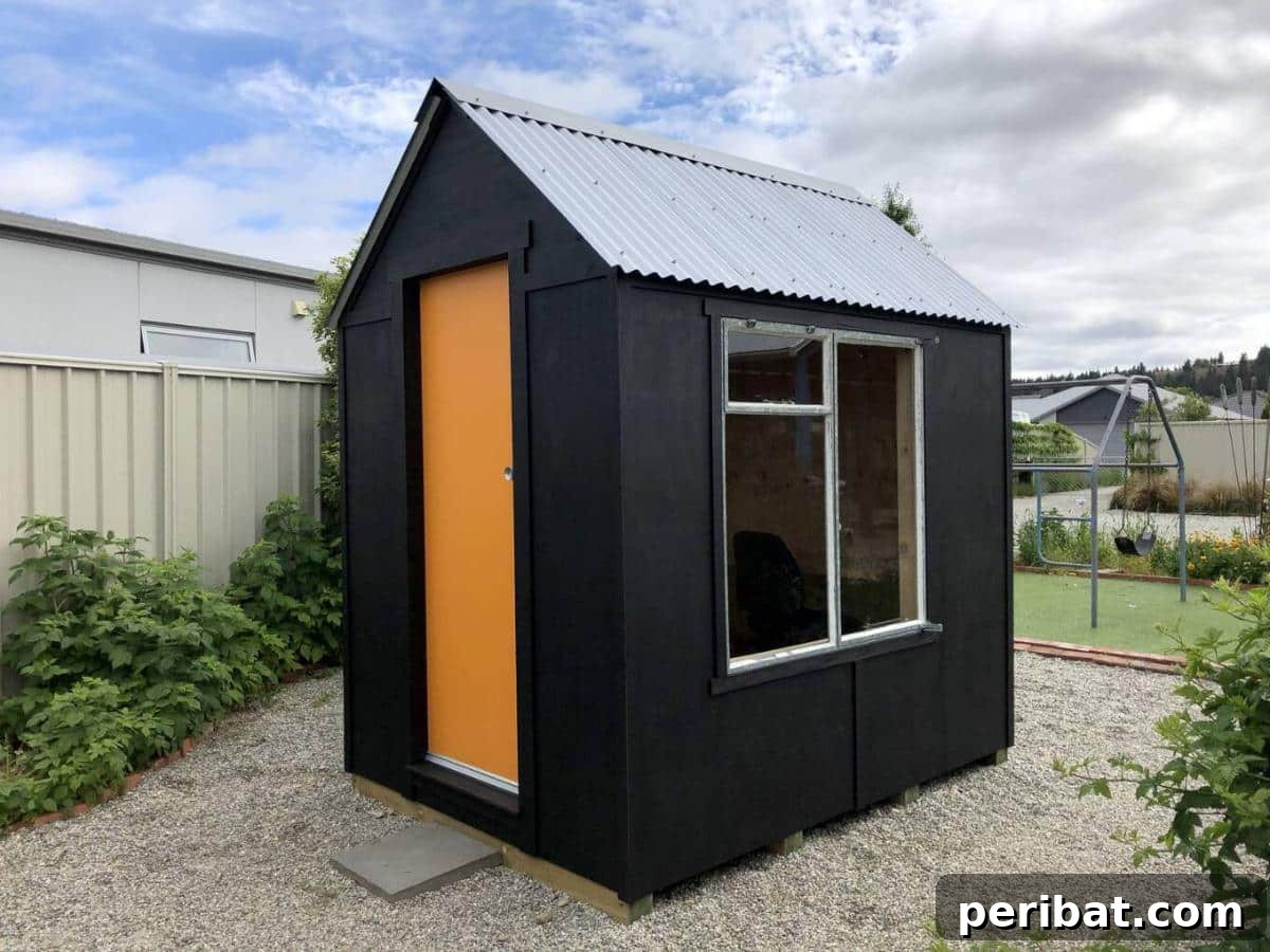 Unlock Your Potential: 42 Inspiring Backyard Studio Shed Designs 16 A tranquil DIY writing studio, designed for focus and creativity, with a comfortable desk and inspiring decor.