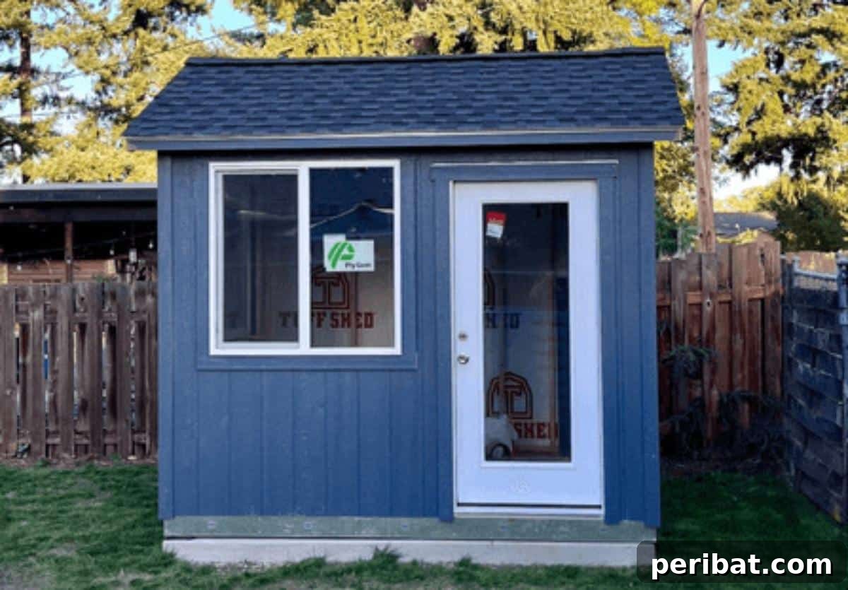 Unlock Your Potential: 42 Inspiring Backyard Studio Shed Designs 19 A modern and cost-effective backyard office built under $20K, demonstrating smart design and budget-friendly construction.