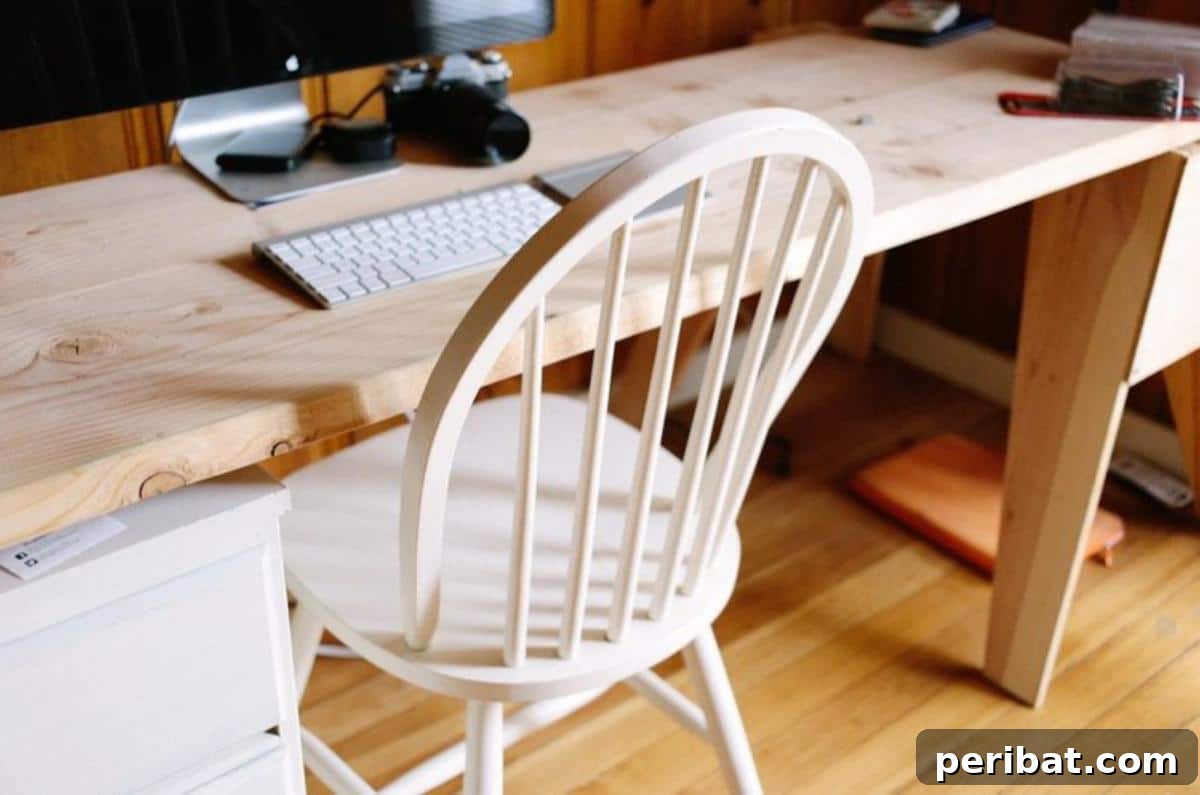 Unlock Your Potential: 42 Inspiring Backyard Studio Shed Designs 20 The inviting interior of a backyard shed office, thoughtfully organized for work and comfort.