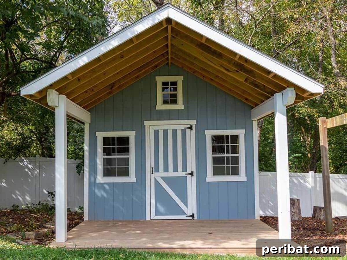 Unlock Your Potential: 42 Inspiring Backyard Studio Shed Designs 32 A charming backyard shed featuring a welcoming front porch, perfect for relaxation or as an entry to a studio.