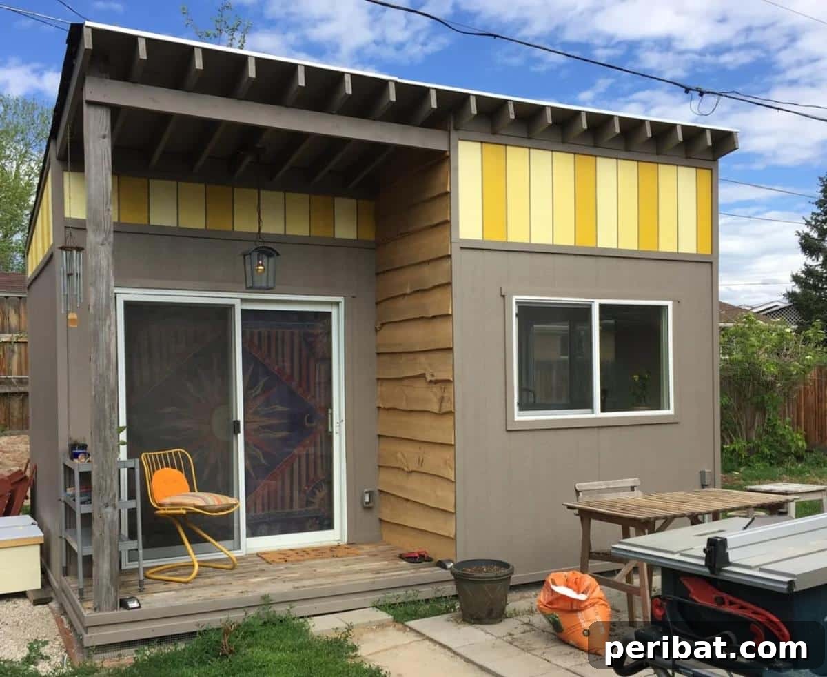 Unlock Your Potential: 42 Inspiring Backyard Studio Shed Designs 9 A bright and inspiring backyard artist studio with large windows for natural light, an easel, and various art supplies.
