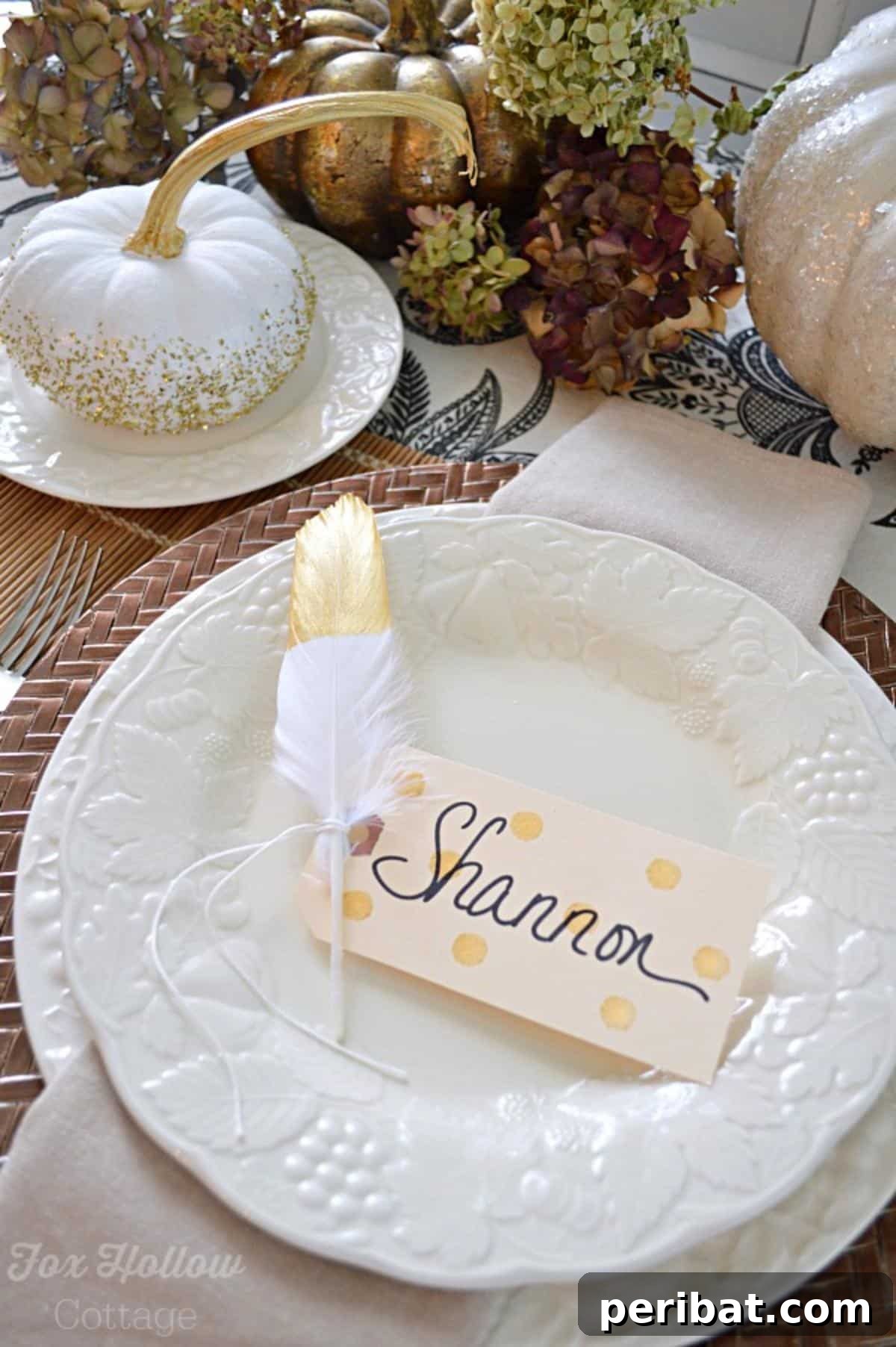 Thanksgiving Table With Gold Feather Polka Dot Place Card. Features place cards adorned with gold feathers and polka dots, adding a glamorous and festive touch to a Thanksgiving table setting.