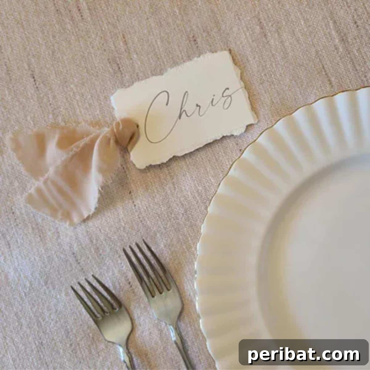 Torn-Edge Ribboned Wedding Place-Card. Features place cards with delicate torn edges and soft ribbons, adding a romantic, textured, and vintage-inspired element to wedding decor.
