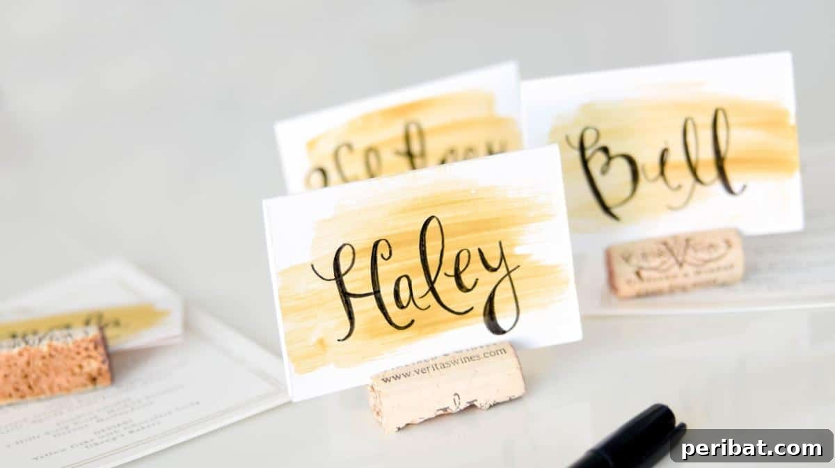 The Easiest Wedding Watercolor Place Cards. Showcases cards with soft, blended watercolor backgrounds and elegant script names, ideal for a sophisticated wedding aesthetic.