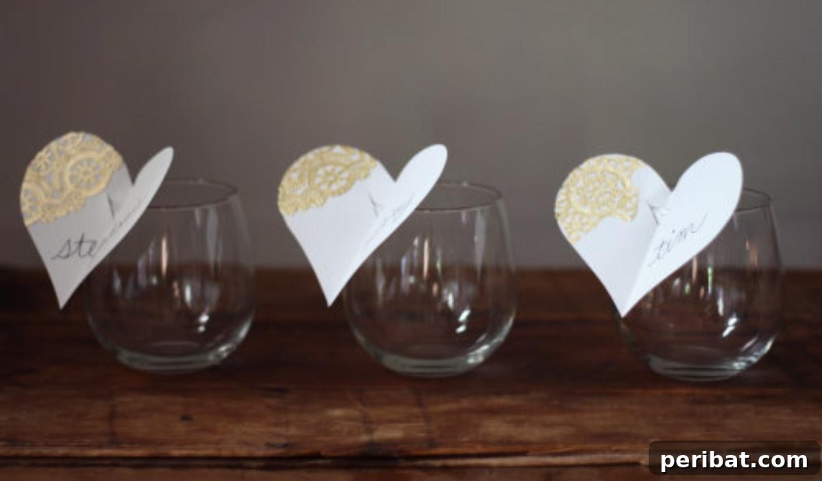 DIY Wine Glass Place Cards. Features small, decorative cards attached to wine glass stems, serving dual purposes as place cards and glass markers, adding functionality and style.
