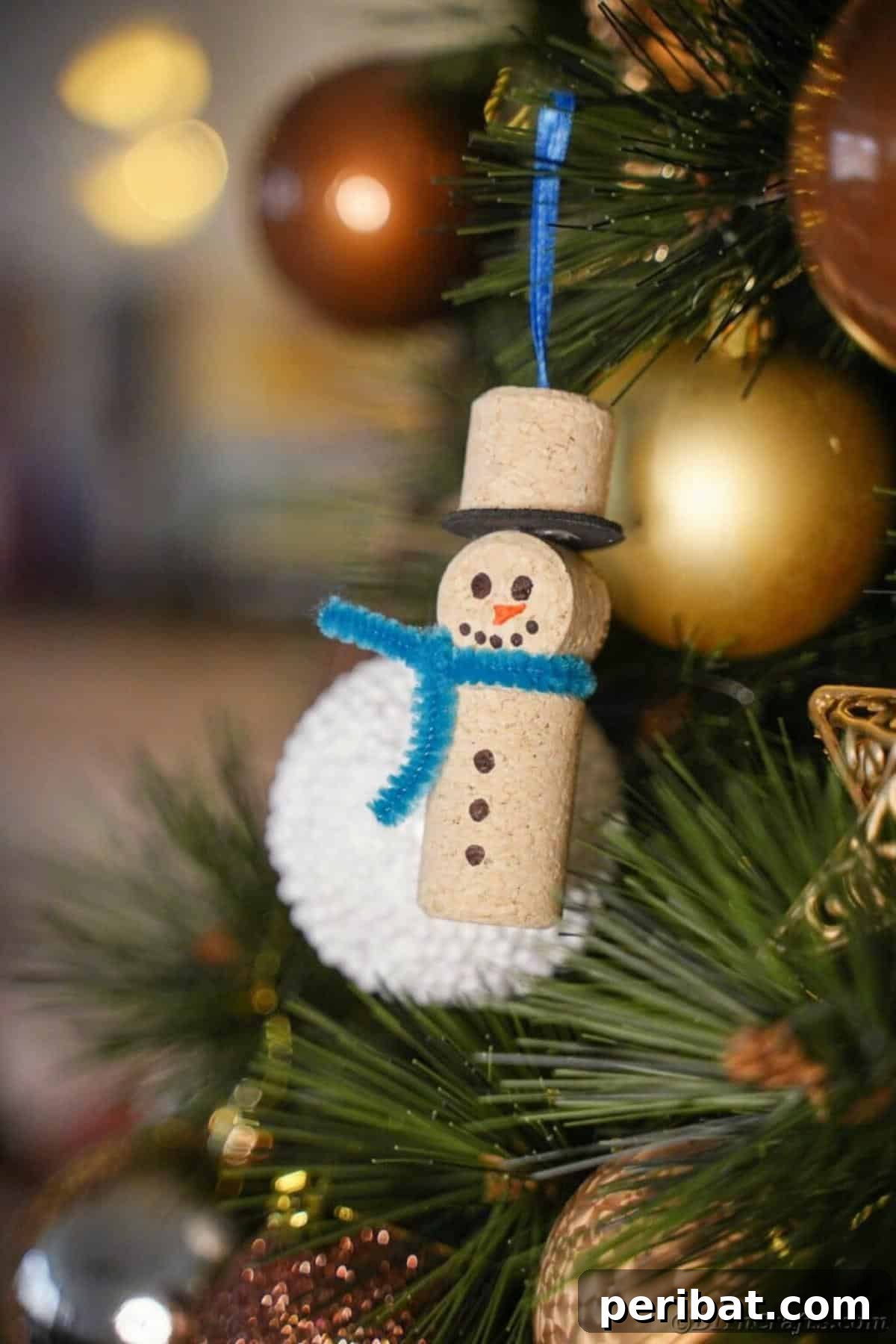 Uncork Your Creativity 50 Wine Cork DIY Projects 13 An adorable wine cork snowman Christmas ornament, featuring stacked painted corks to resemble a snowman, complete with tiny accessories like a scarf or hat.