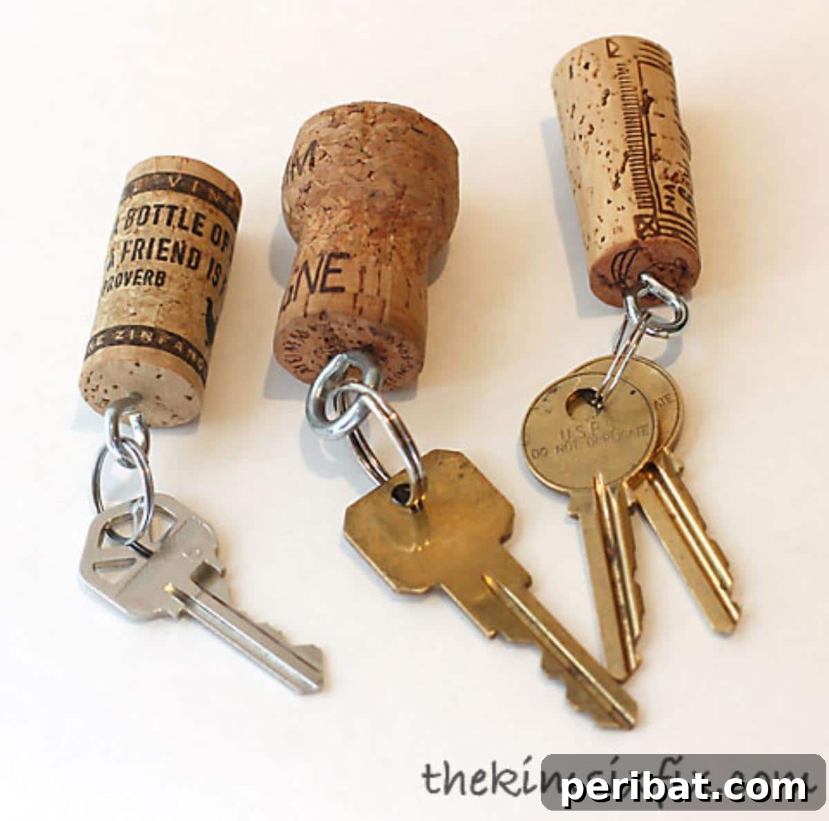 Uncork Your Creativity 50 Wine Cork DIY Projects 17 Several wine cork keychains, ideal for pool or beach use, with attached keyrings and possibly small decorative beads or charms.