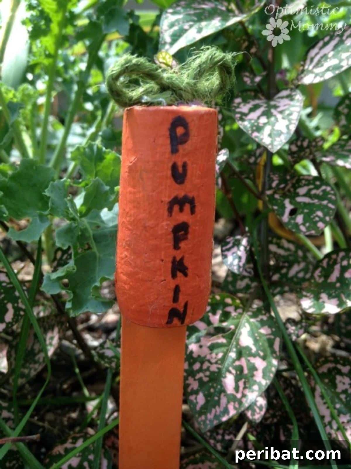 Uncork Your Creativity 50 Wine Cork DIY Projects 36 A wine cork pumpkin garden marker, a small craft made from a wine cork painted orange and shaped like a pumpkin, used to label plants in a garden.