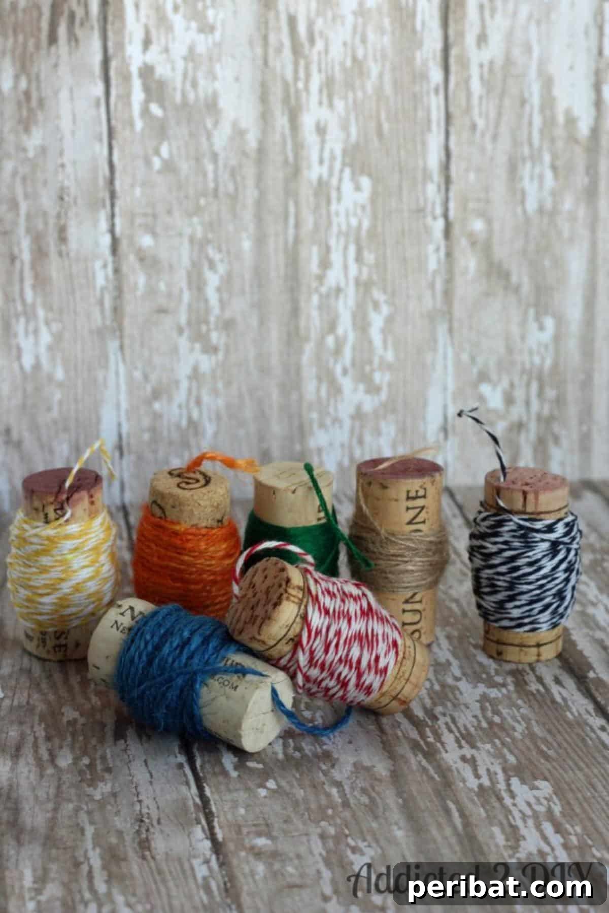Uncork Your Creativity 50 Wine Cork DIY Projects 37 Wine Cork Spools for twine and floss, illustrating how wine corks can be repurposed to neatly organize small spools of crafting thread or twine.