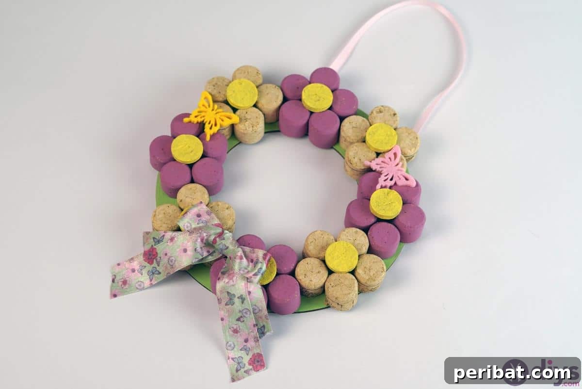 Uncork Your Creativity 50 Wine Cork DIY Projects 44 A beautiful DIY Wine Cork Floral Wreath, demonstrating how to create an elegant wreath by attaching various wine corks and artificial flowers to a base.