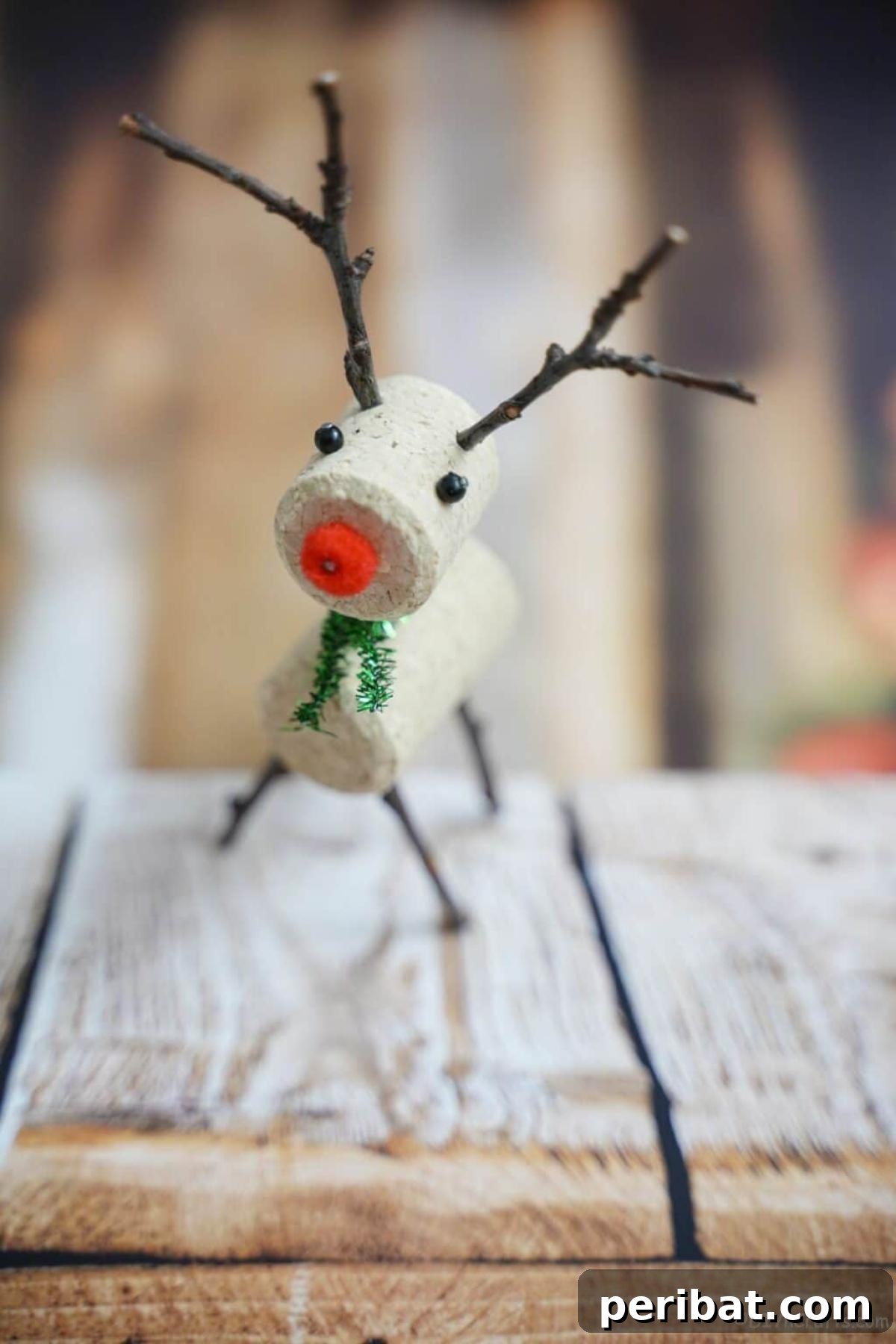 Uncork Your Creativity 50 Wine Cork DIY Projects 10 A rustic wine cork reindeer Christmas ornament, crafted from wine corks and small branches or pipe cleaners for antlers, adding a charming, homemade touch to holiday decor.